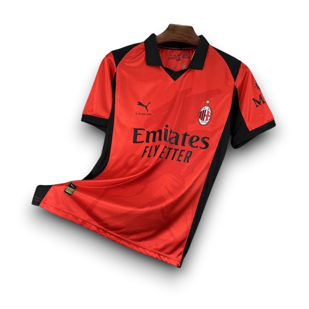 Leazofoot AC Milan 26/27 third football jersey in red and black with polo collar and team crest on a metal rack.