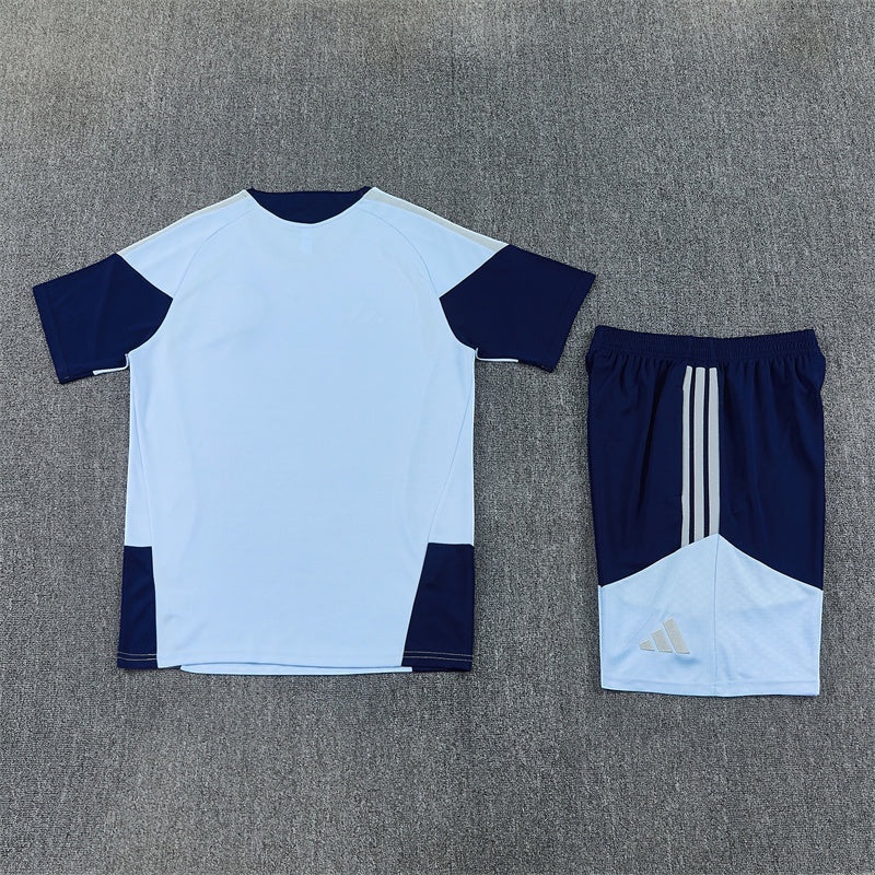 Leazofoot Ajax 26/27 training kit featuring a light blue and navy short-sleeve jersey and matching athletic shorts.