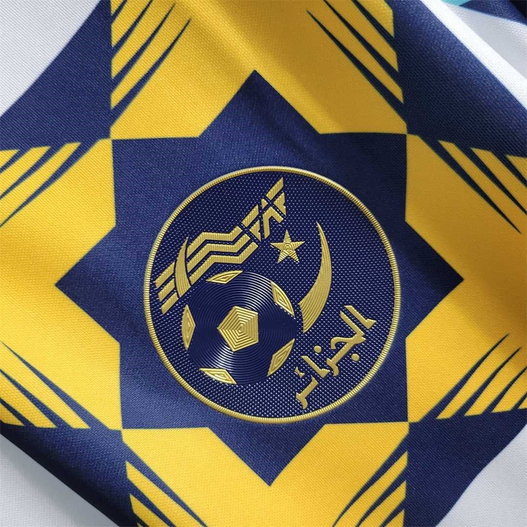 Leazofoot Algeria 2022 training jersey featuring a blue and yellow geometric pattern and embroidered team crest.