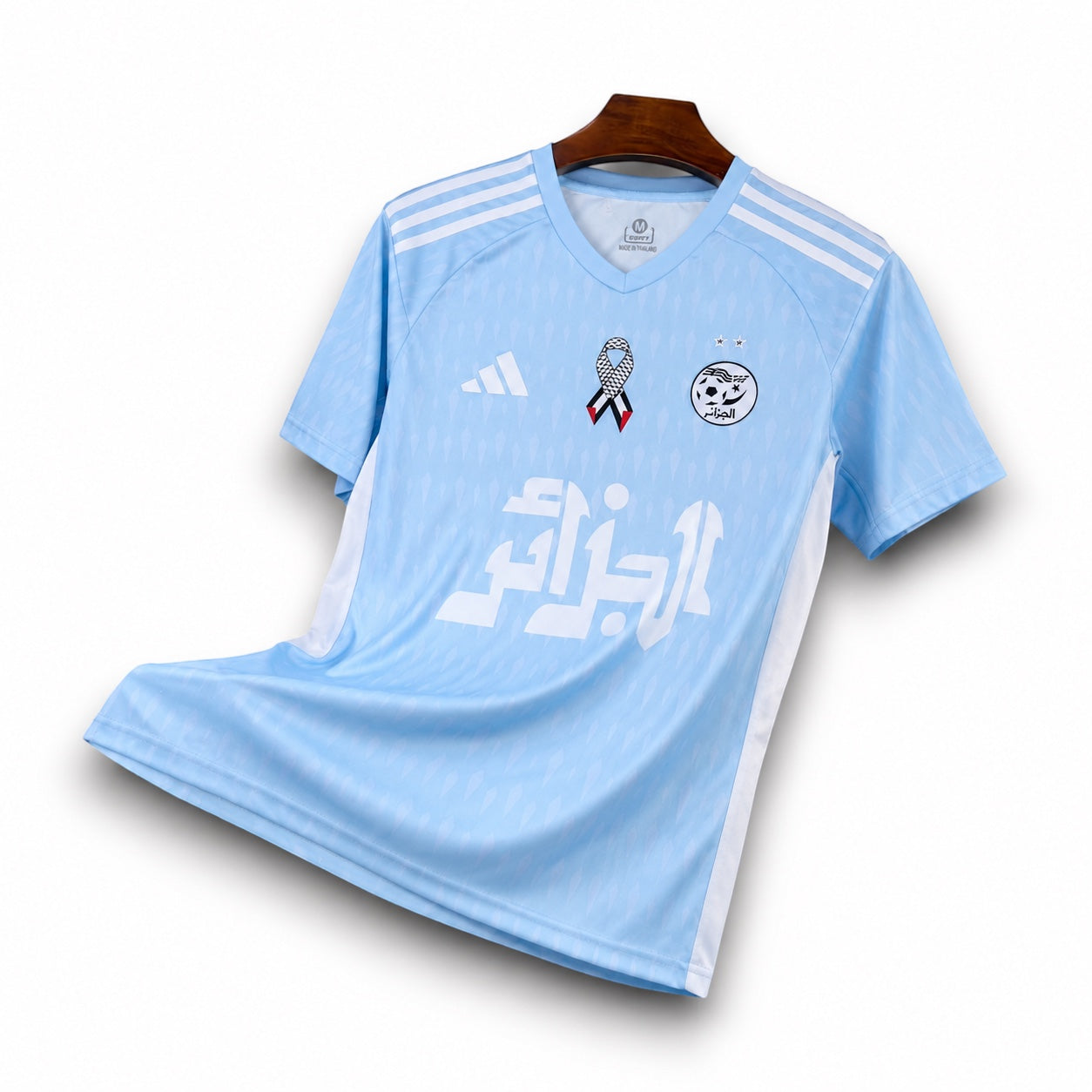 Leazofoot light blue Algeria 2025 concept football jersey with white accents and national team crest on hanger.