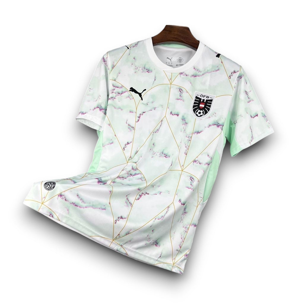 Leazofoot Austria 2026 away football jersey in white with a green marble pattern, gold geometric lines, and team crest.