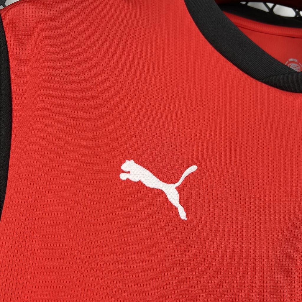 Leazofoot Austria 2026 home soccer jersey in red with black trim and white Puma logo detail.
