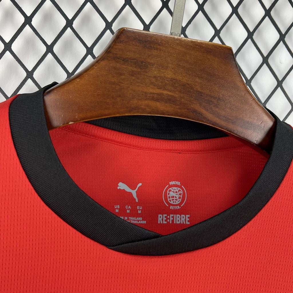 Leazofoot Austria 2026 home football jersey in red with black crew neck collar and RE:FIBRE sustainable fabric detail