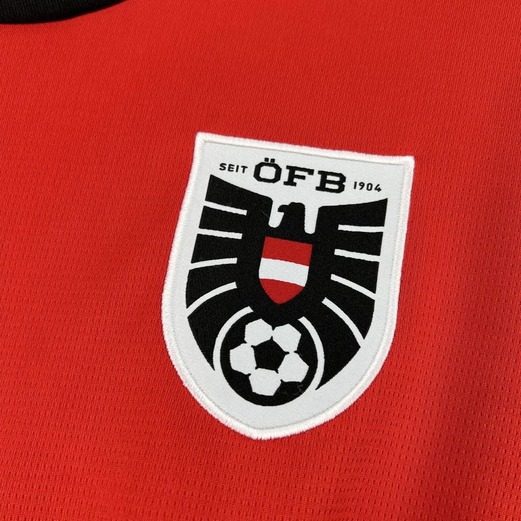 Leazofoot 2026 Austria home soccer jersey in red with embroidered ÖFB national team crest and black collar detail.