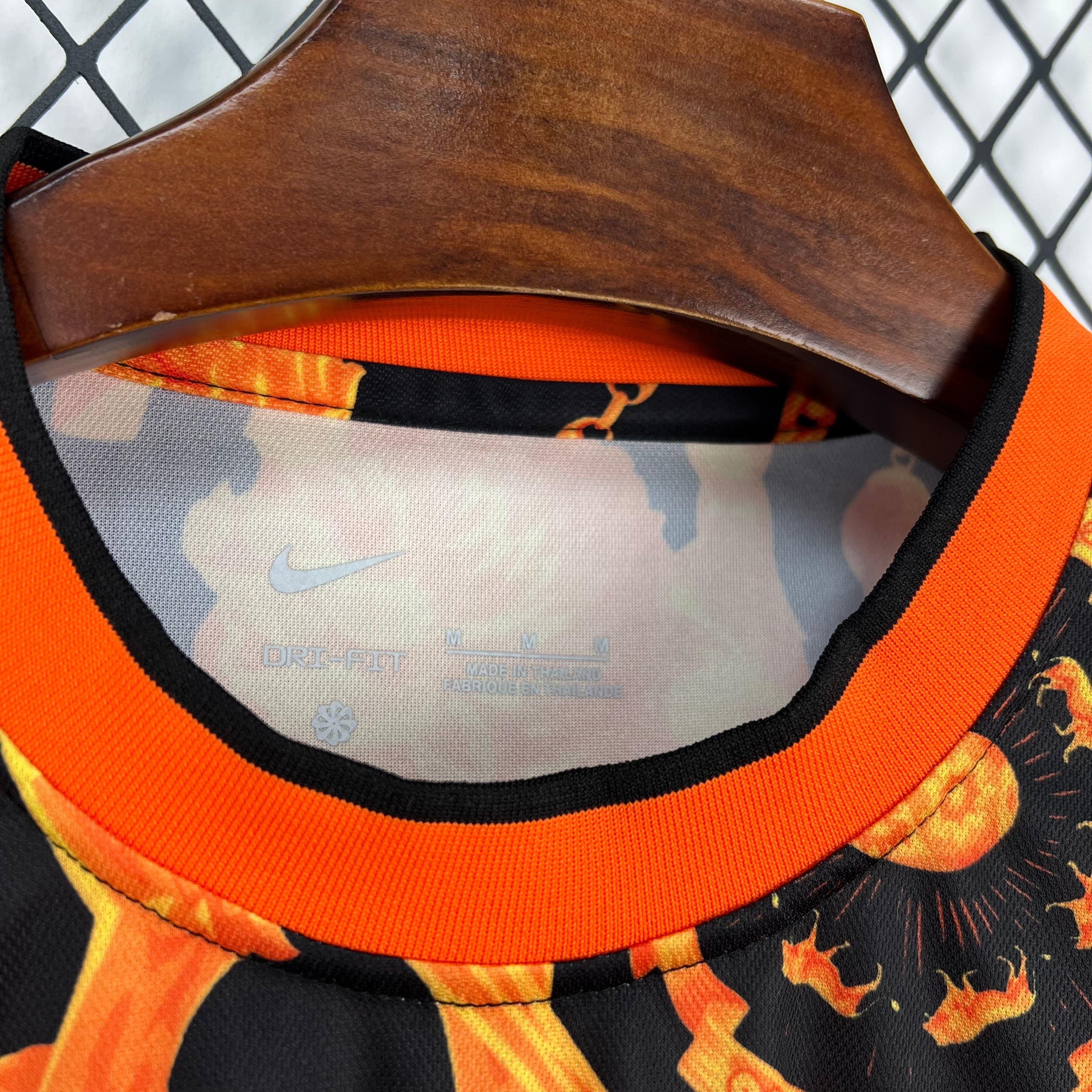 Leazofoot black and orange flame print Dri-FIT football jersey with black and orange collar