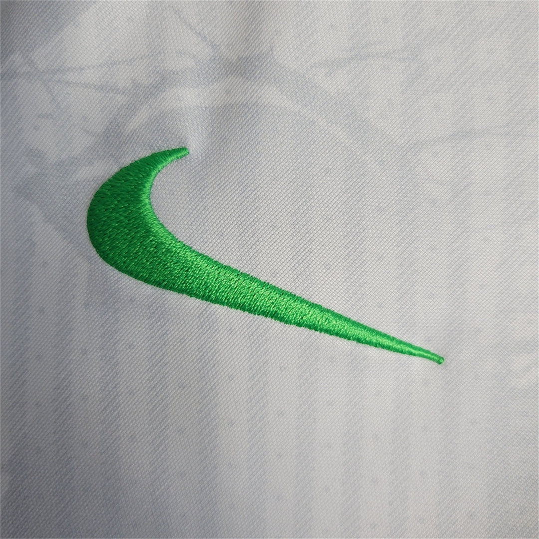 Leazofoot BRÉSIL 2024 concept jersey featuring a vibrant green embroidered swoosh logo on a white textured fabric.