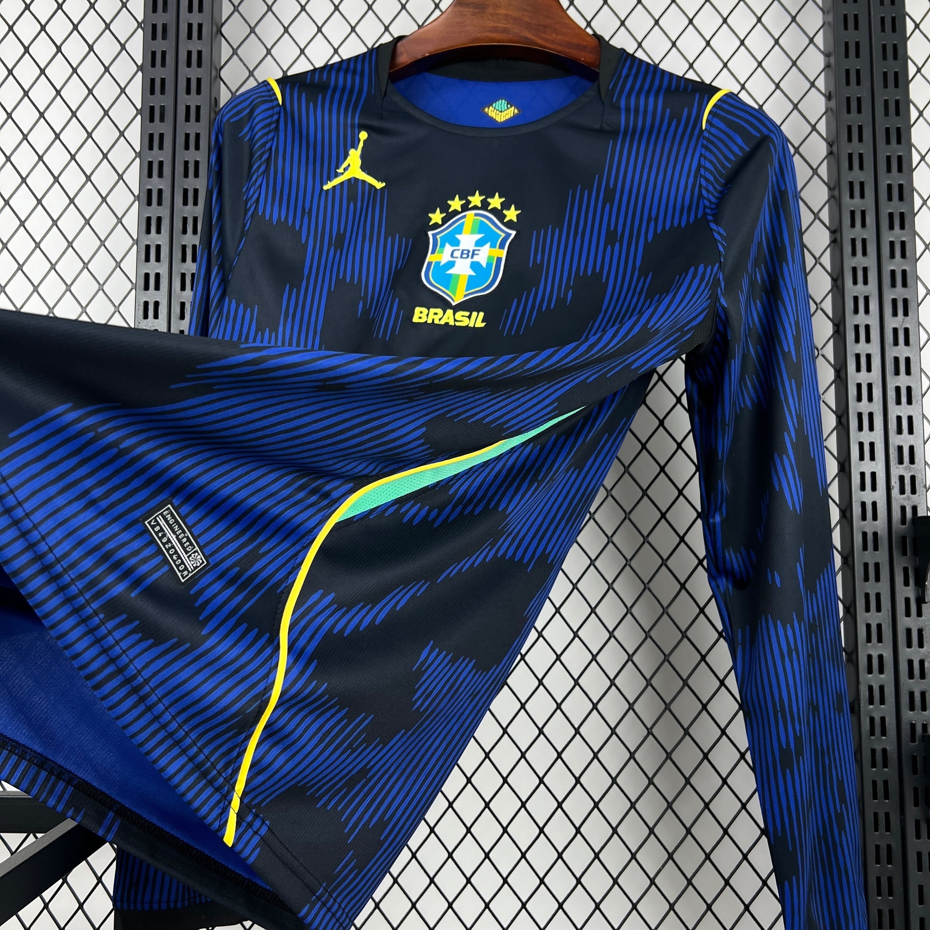 Leazofoot Brasil long sleeve football jersey, black with blue abstract pattern, yellow accents, CBF crest, and Jordan logo.
