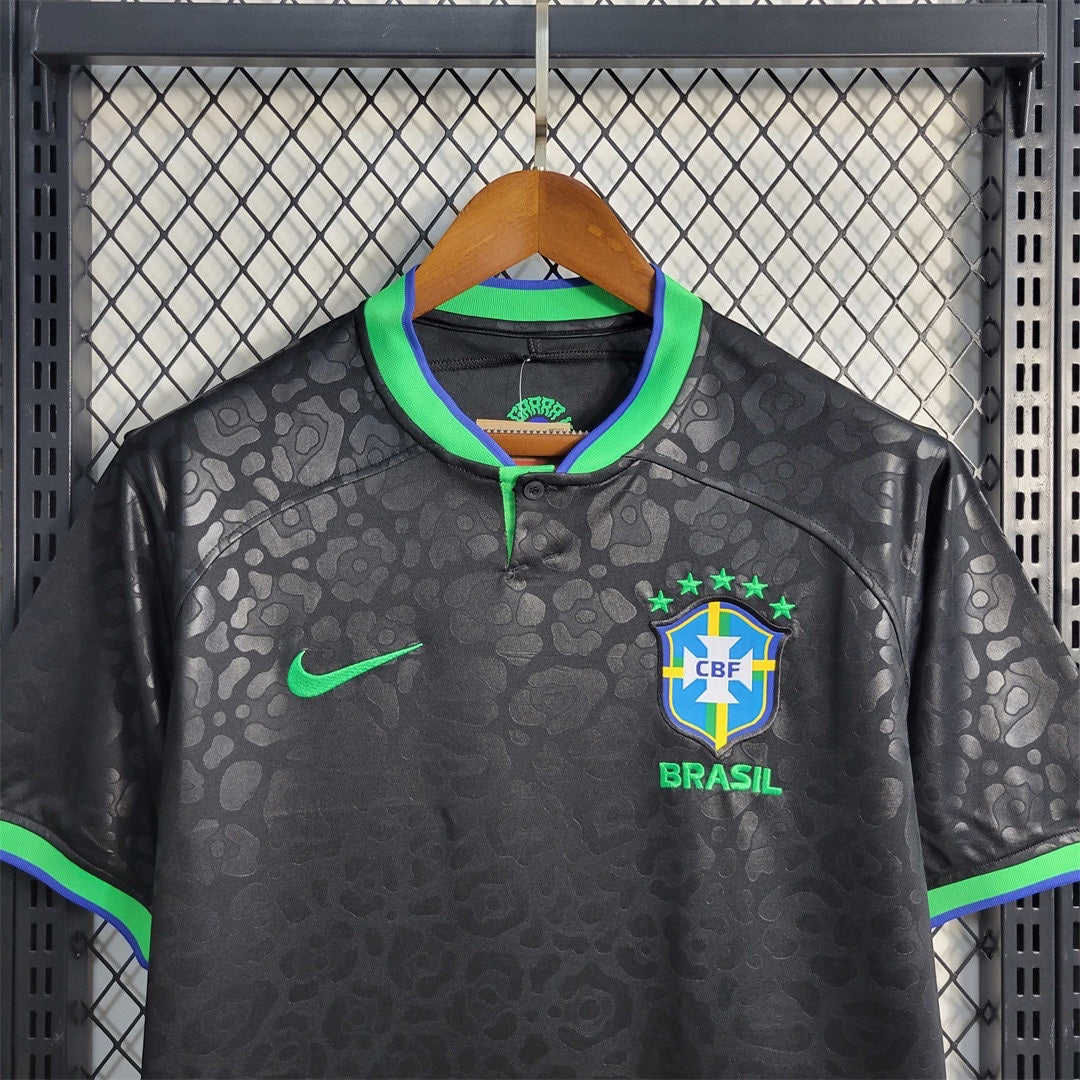 Leazofoot black Brazil 2023 concept soccer jersey with tonal leopard print, green accents, and CBF crest.