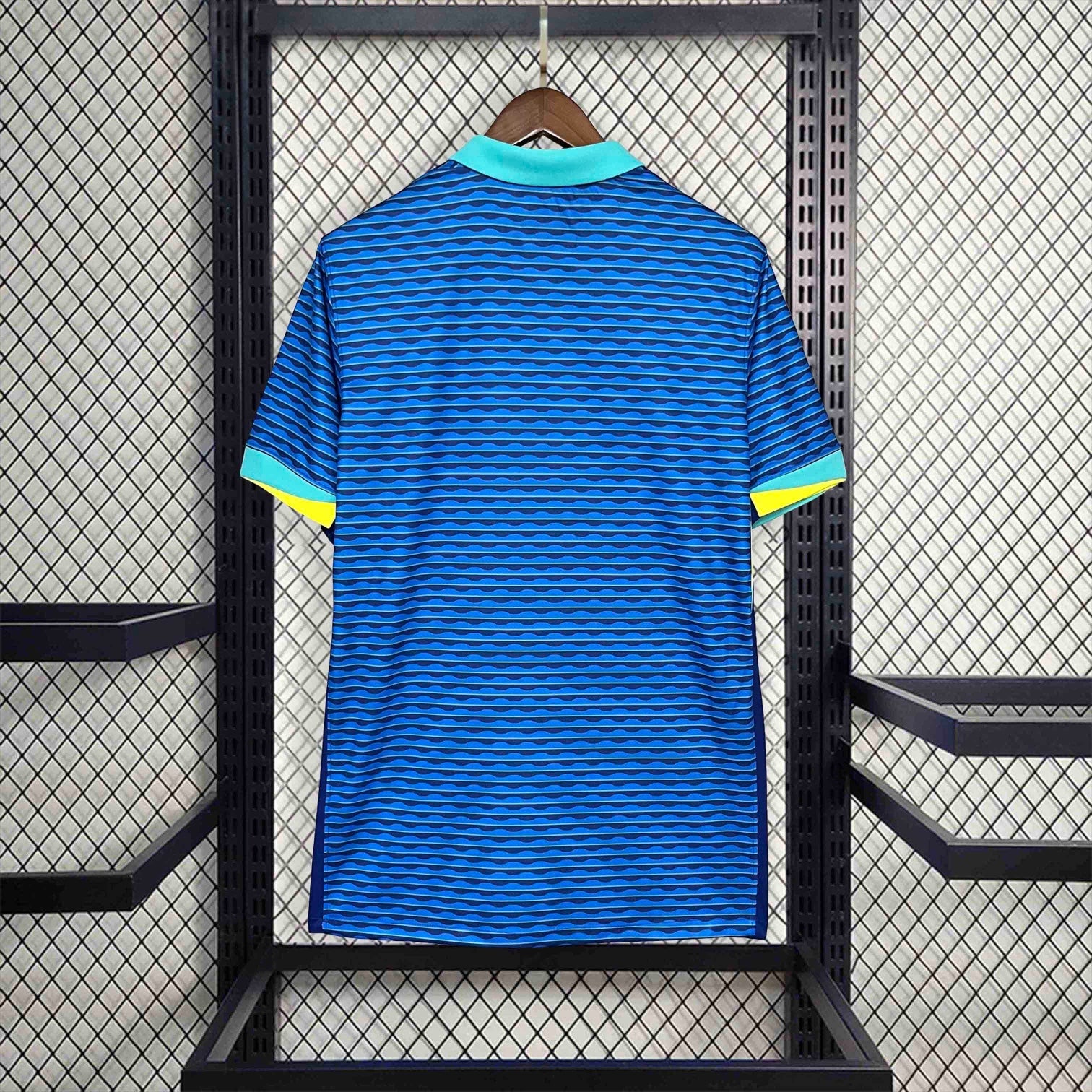 Leazofoot Brazil 2024 away soccer jersey in blue with horizontal wave pattern, teal collar, and yellow sleeve trim.