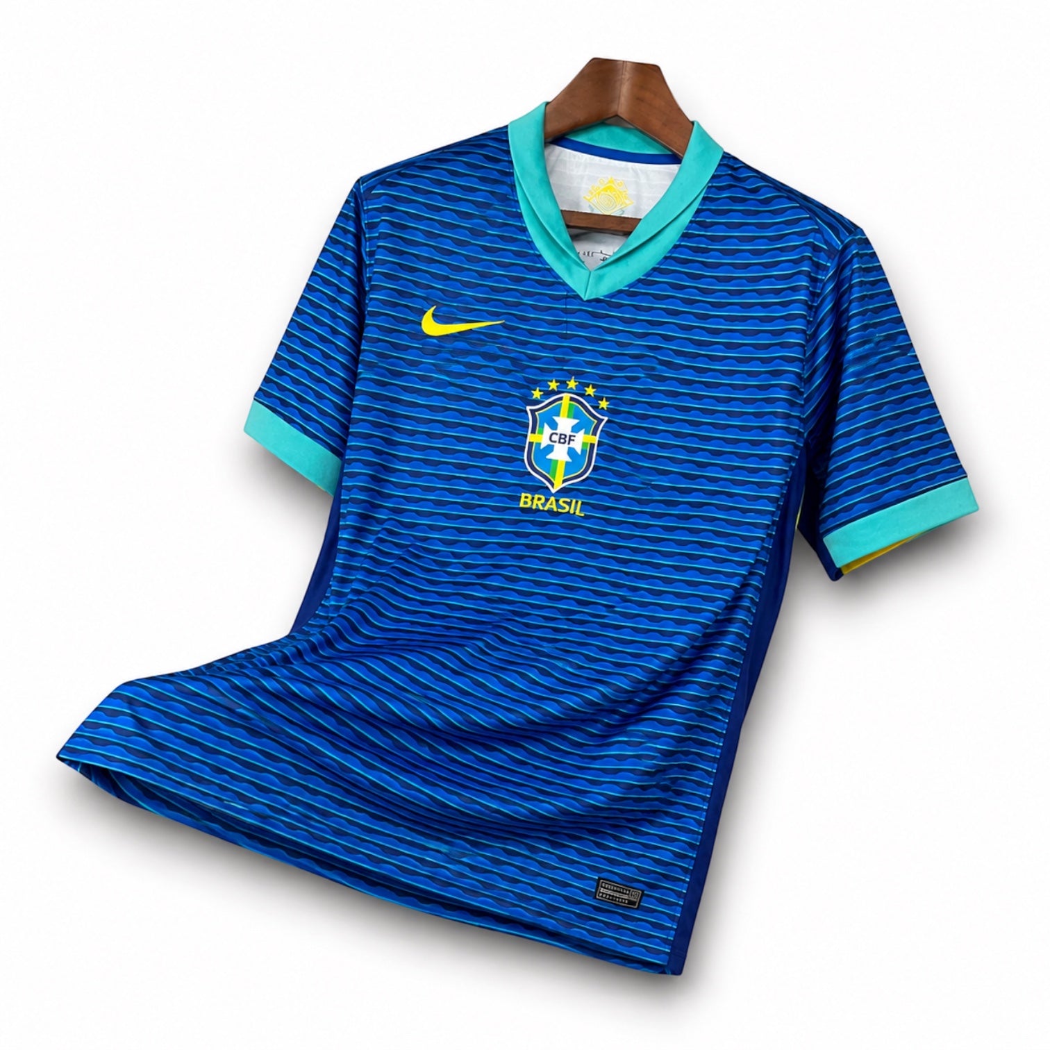 Leazofoot Brazil 2024 away soccer jersey in blue with wavy pattern, teal V-neck, and yellow Nike swoosh logo.