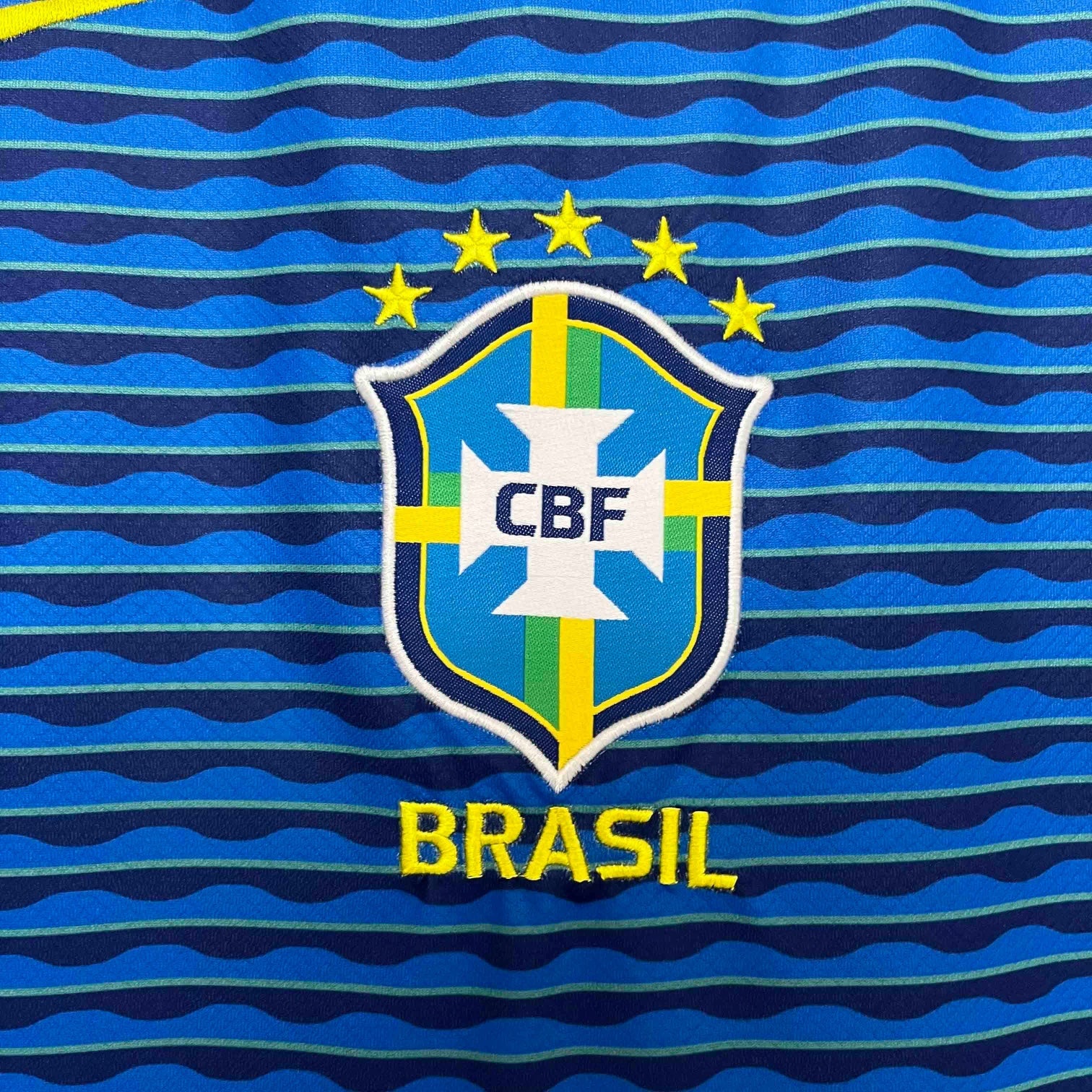 Leazofoot Brazil 2024 away football jersey with blue wavy stripe pattern and embroidered CBF crest with five stars.