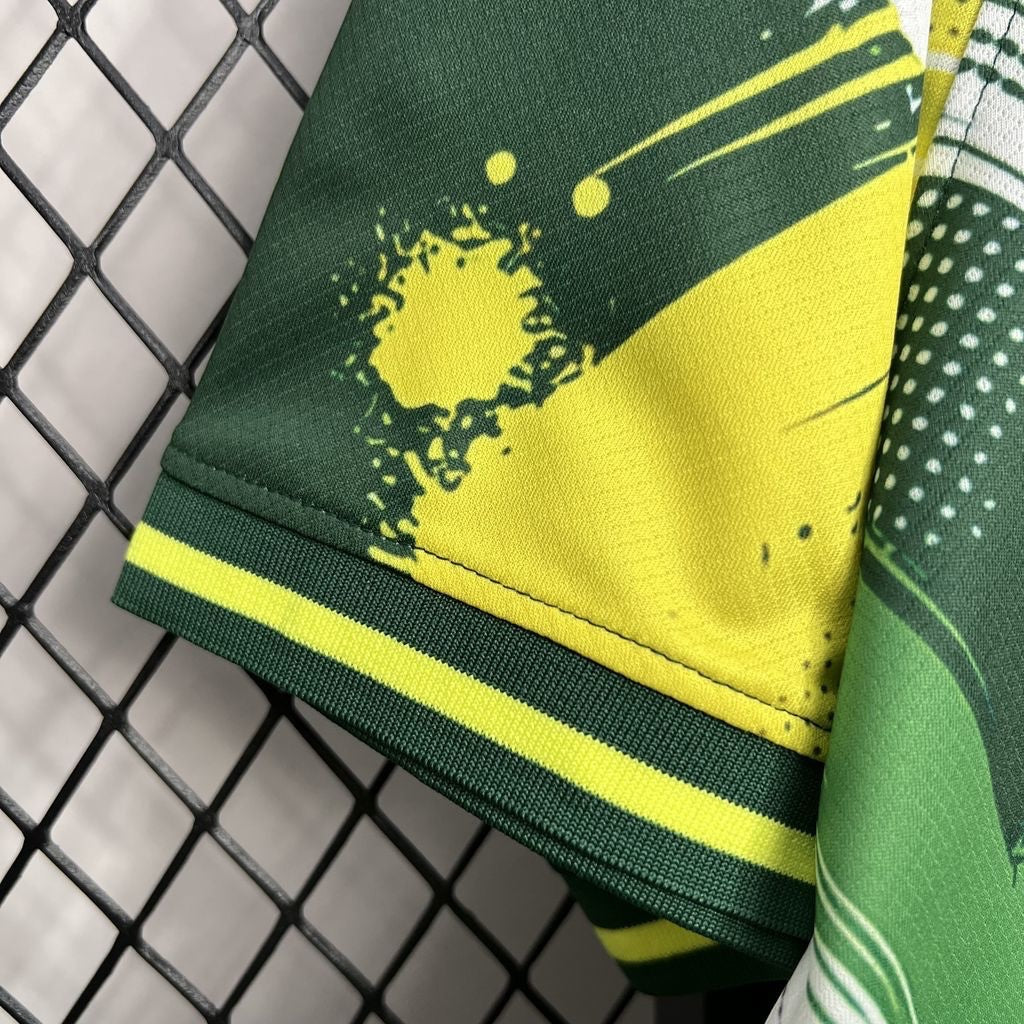 Leazofoot Brazil 24/25 special edition soccer jersey sleeve with green and yellow graphic print and striped trim.