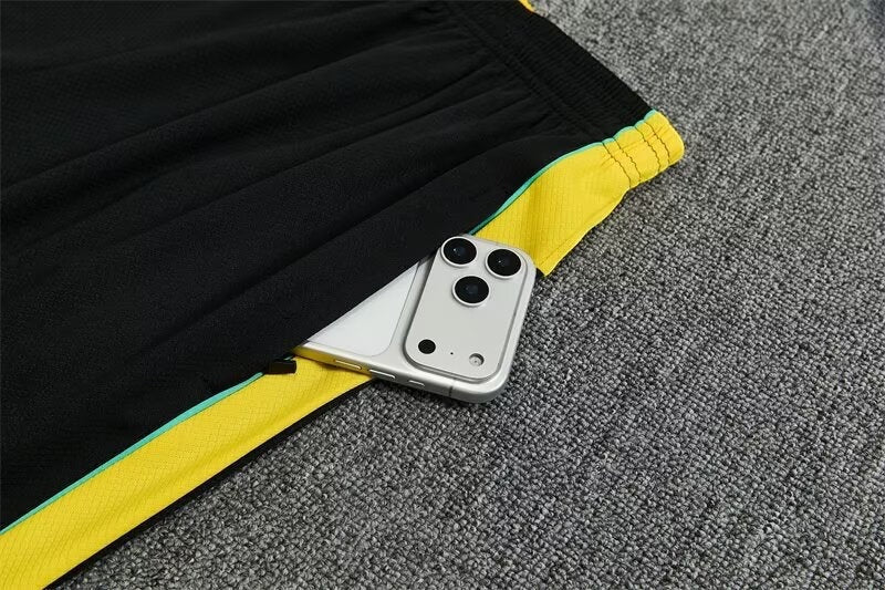 Leazofoot Brazil 2026 training shorts in black with yellow and teal accents featuring a convenient zippered pocket