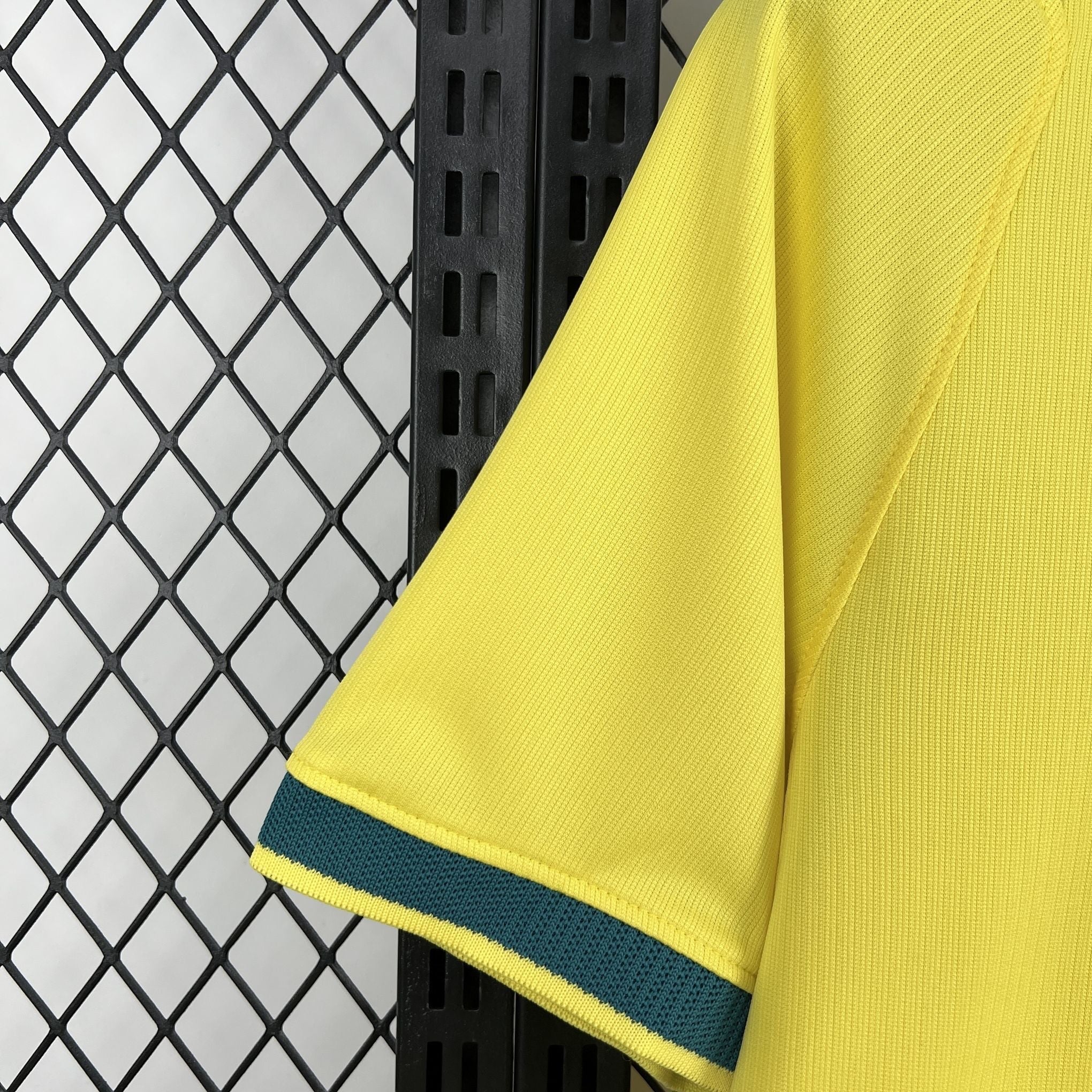 Leazofoot BRÉSIL 2026 home jersey, bright yellow with dark green trim on the sleeve cuffs.