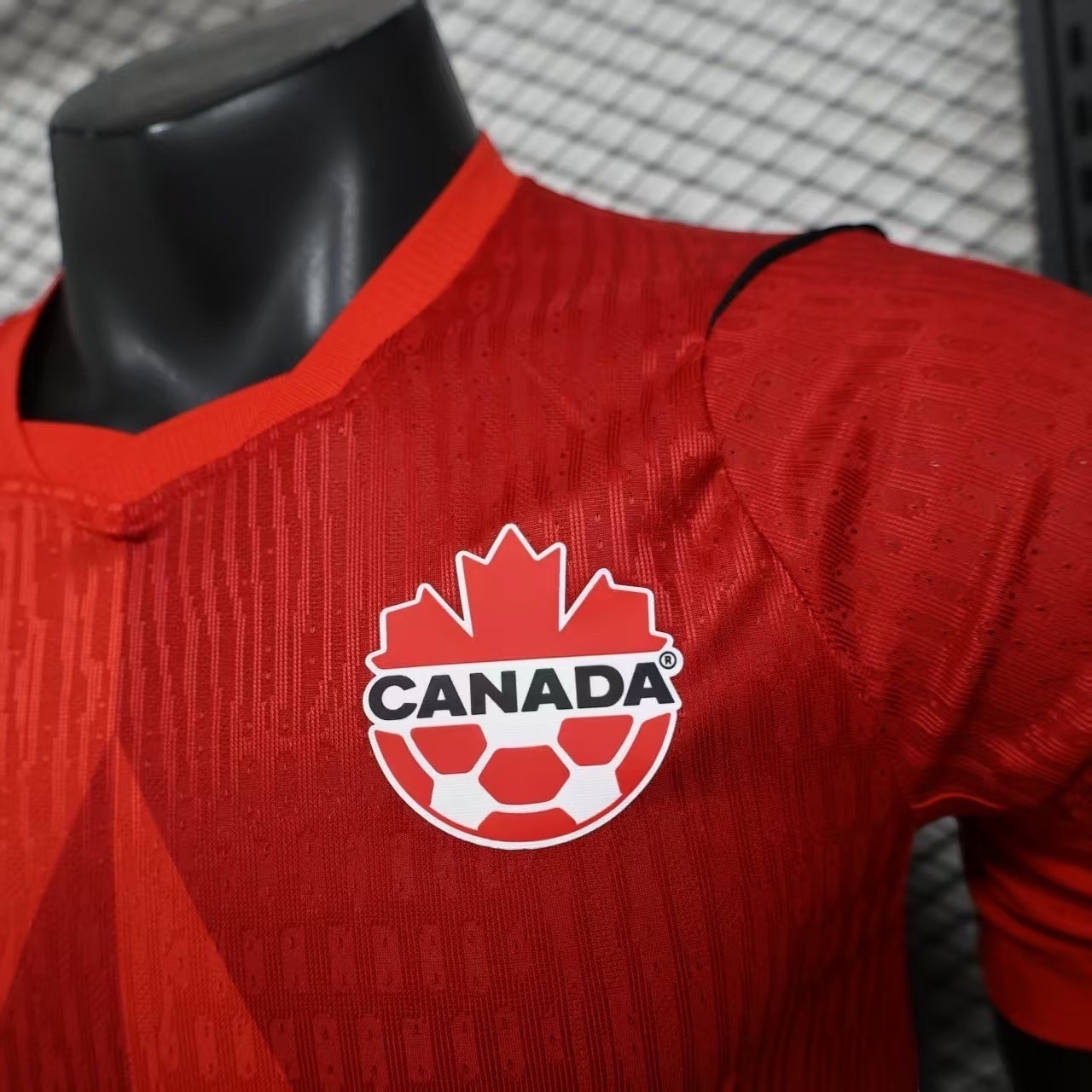 Leazofoot Canada Soccer jersey in red, featuring a maple leaf graphic and official crest. Lightweight, breathable fabric.