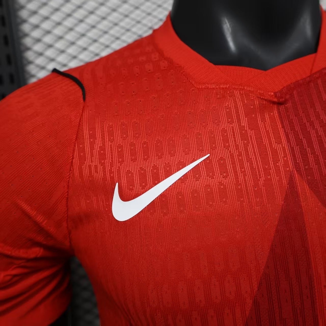 Leazofoot Canada Soccer jersey in vibrant red with white Nike Swoosh and maple leaf graphic. Lightweight, breathable fabric.