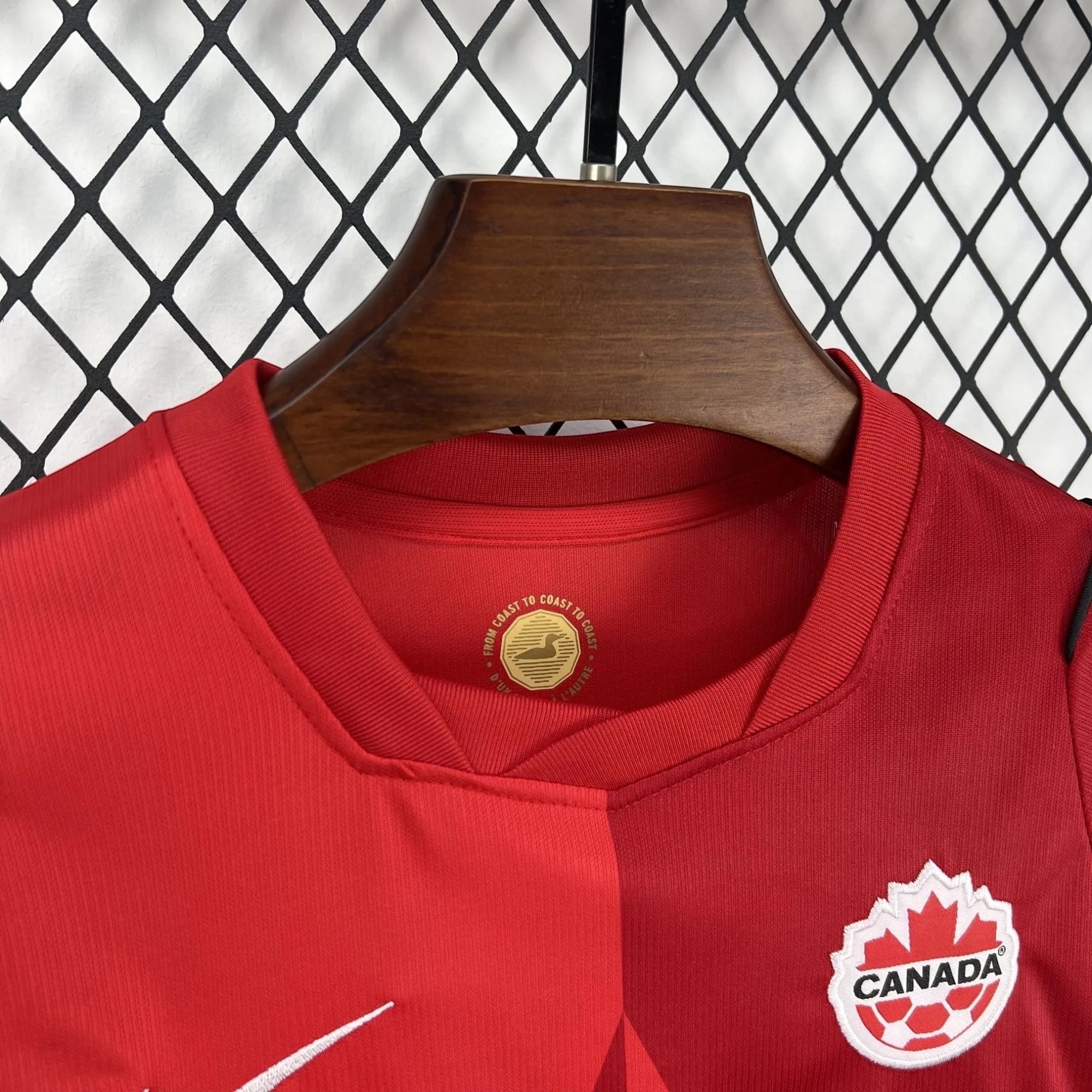 Leazofoot Canada Soccer National Team red jersey and shorts set with Nike logo and Canada emblem. Split red design.