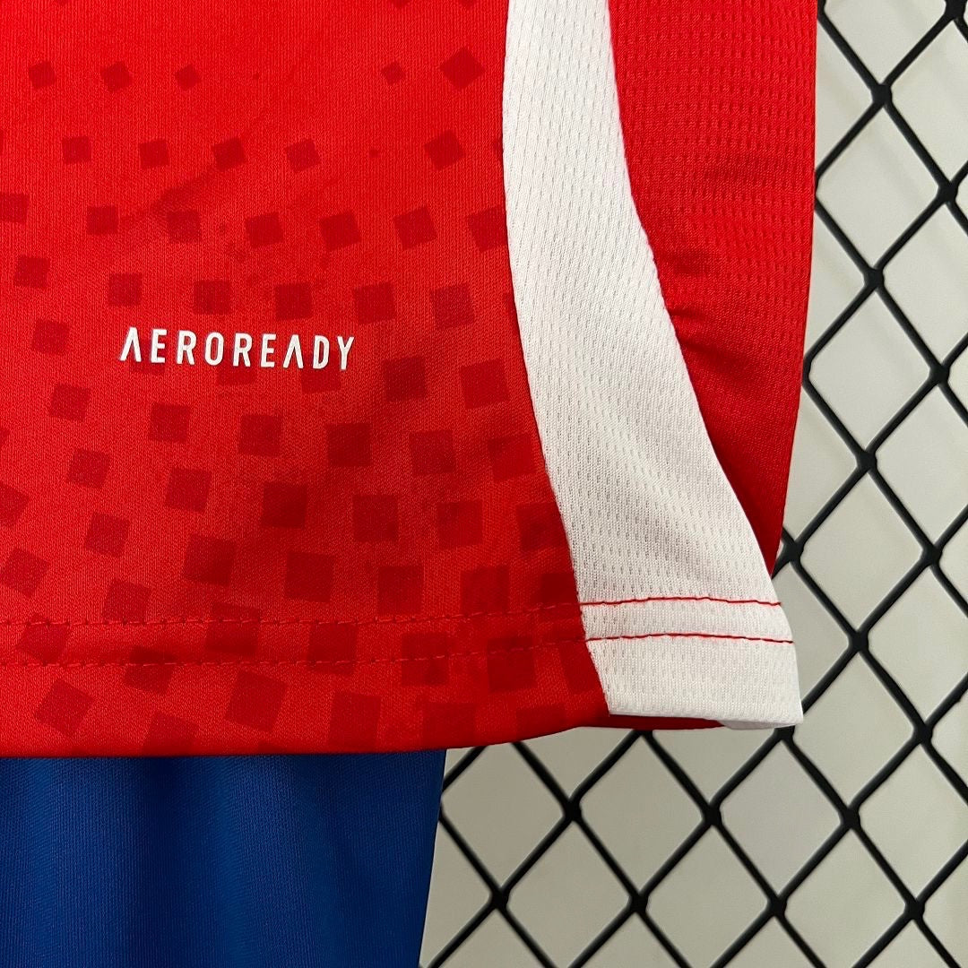 Leazofoot Chile 2024 kids home soccer kit featuring red jersey with Aeroready technology and white side panels.