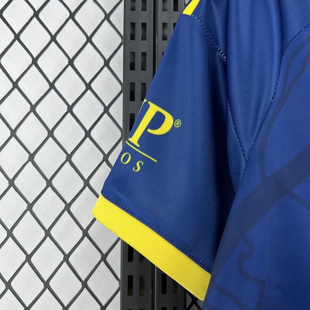Leazofoot Club América 26/27 away jersey sleeve in blue with yellow trim and sponsor logo detail.