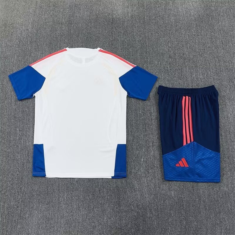 Leazofoot Colombia 2026 training set featuring a white jersey with blue sleeves and matching blue shorts with red details.