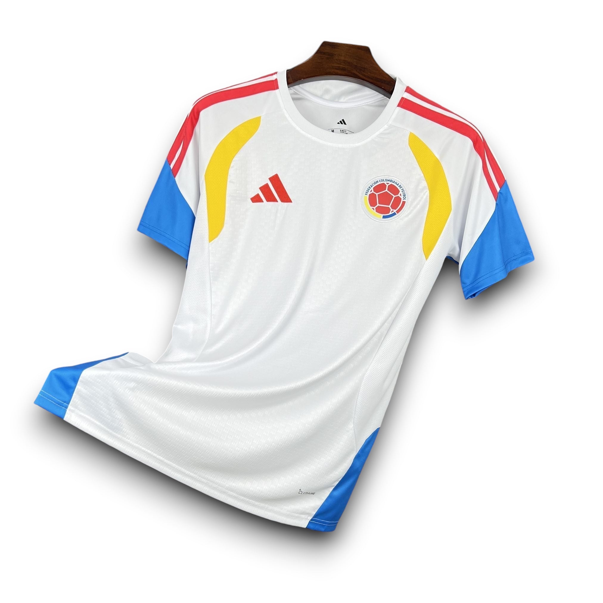 Leazofoot Colombia 2026 pre-match football jersey. White with yellow and blue accents on sleeves and sides.