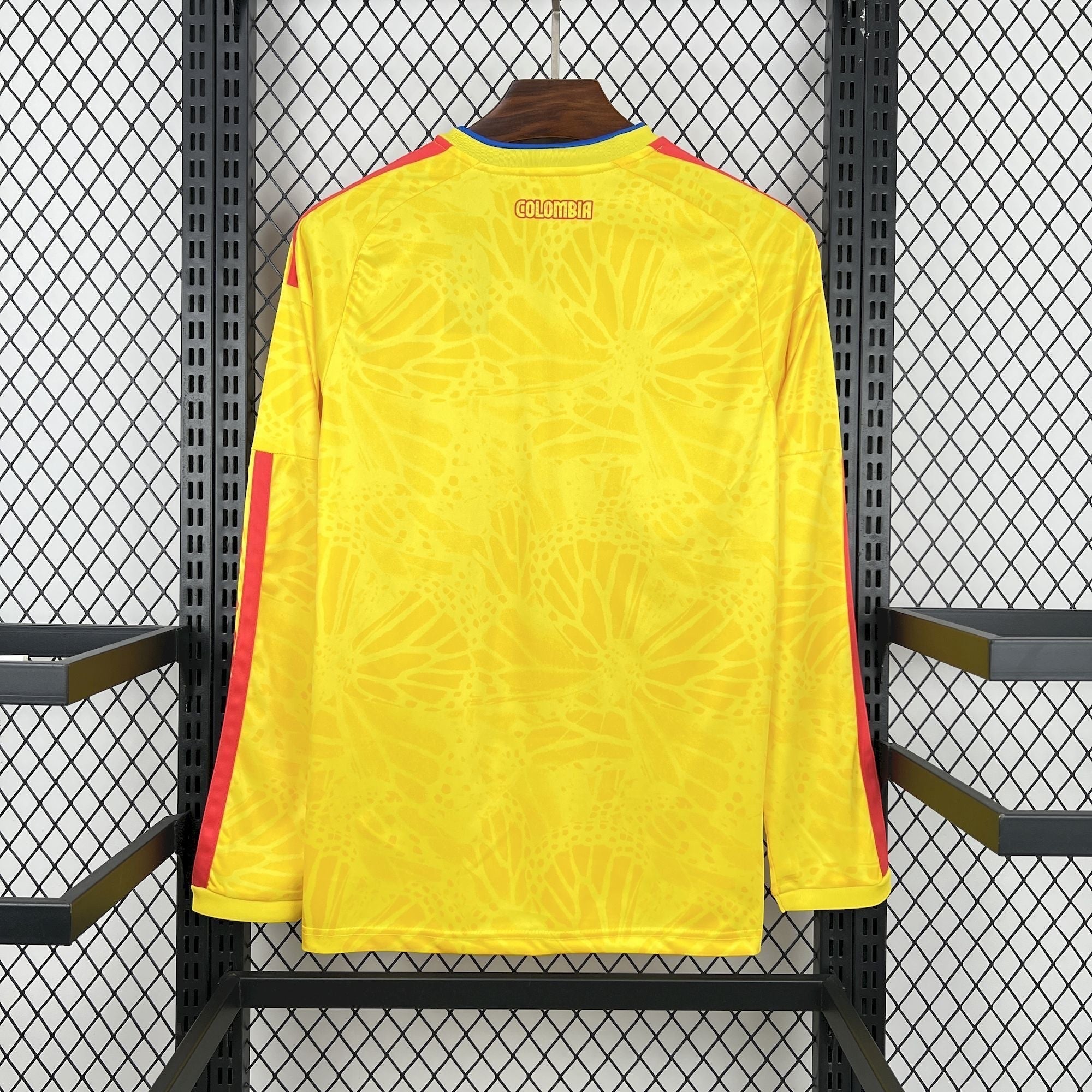 Leazofoot Colombia long sleeve home jersey 2026 in yellow with butterfly pattern and red accents on sleeves.