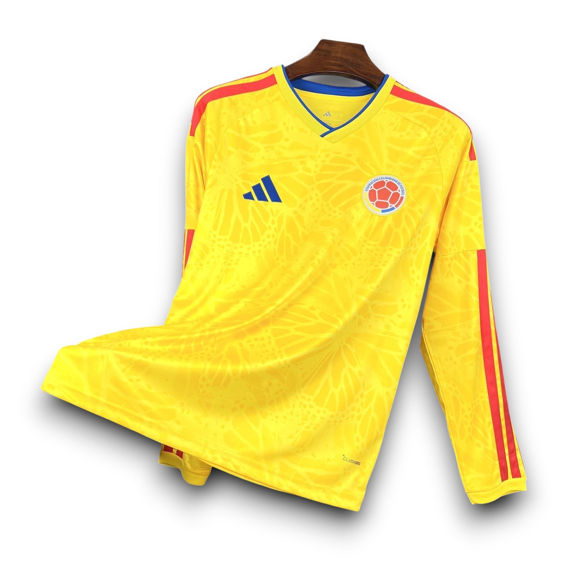 Leazofoot Colombia long-sleeve home soccer jersey 2026 in yellow with red accents and a subtle geometric pattern.