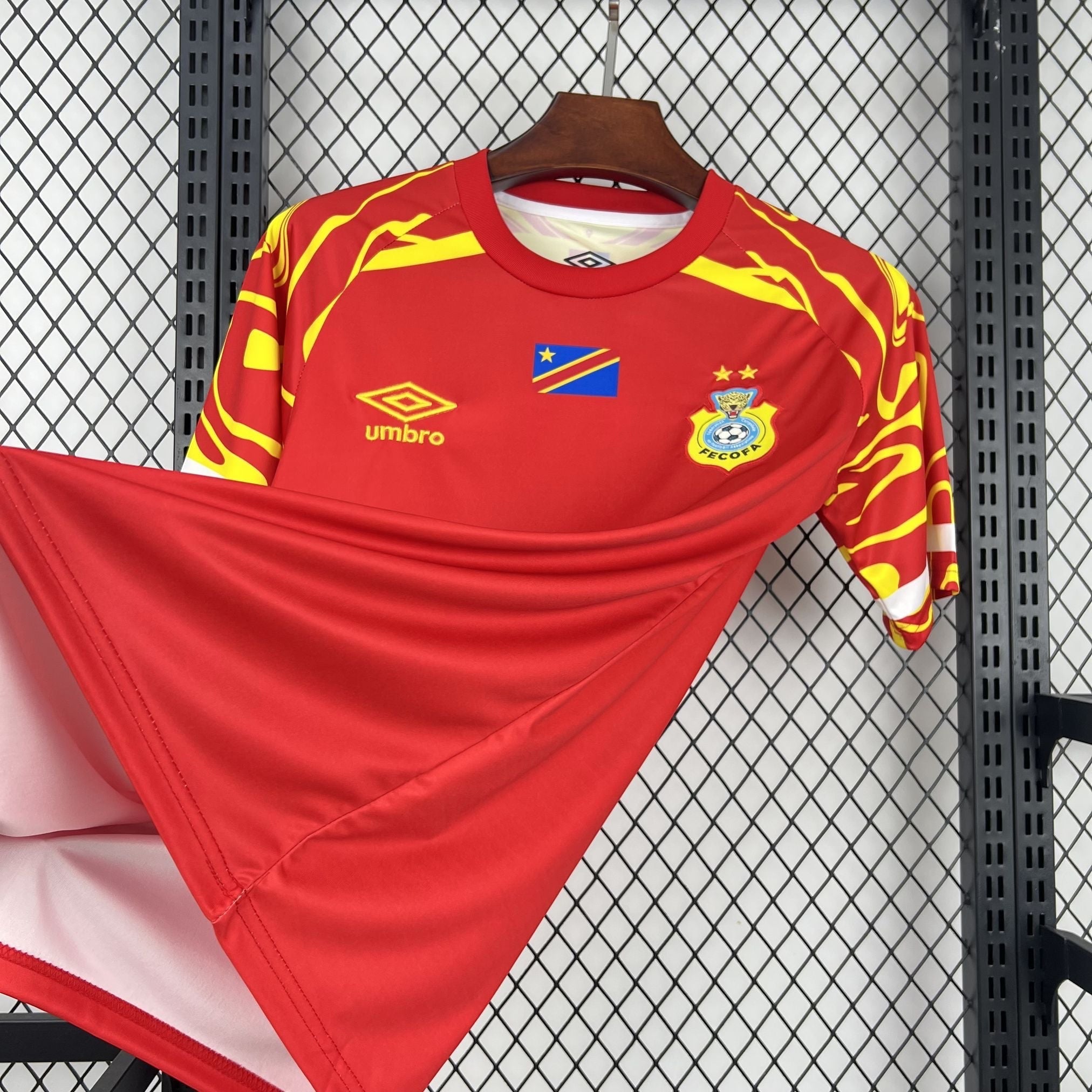 Leazofoot CONGO third football jersey 2026, red with yellow abstract pattern on sleeves and shoulders.
