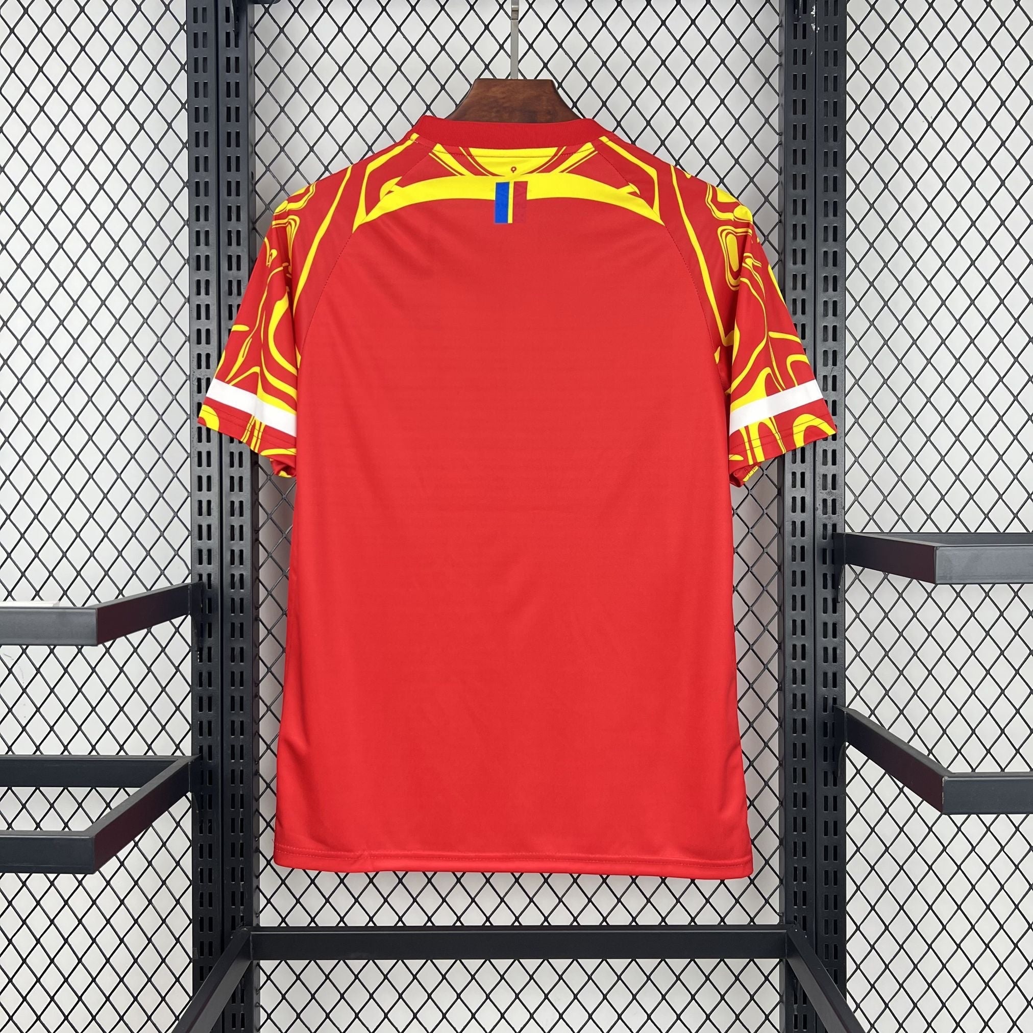 Leazofoot CONGO third football jersey 2026, red with yellow abstract pattern on sleeves and shoulders.