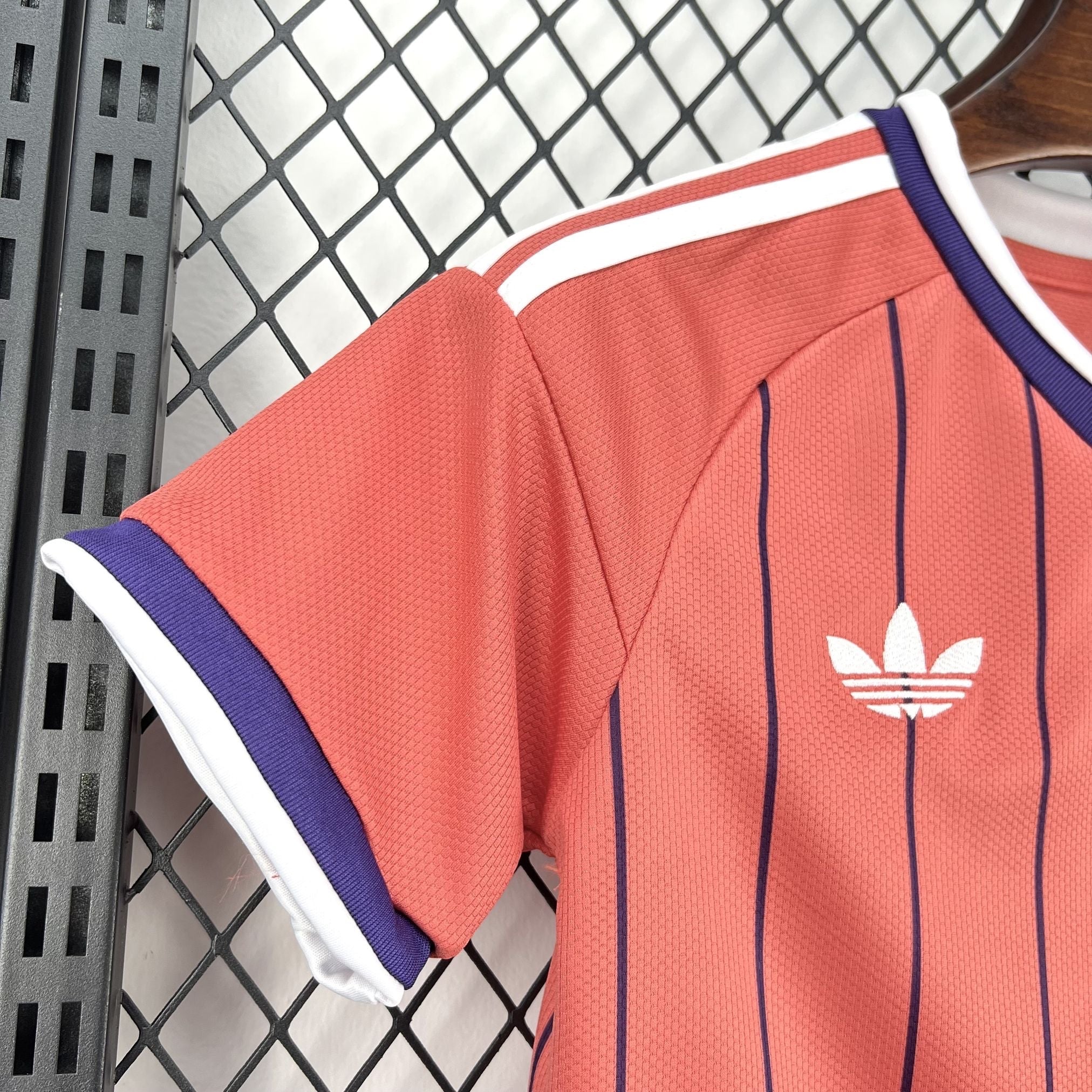 Leazofoot coral pink striped t-shirt with white and purple trim. Features Adidas logo.