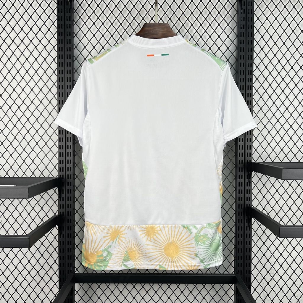 Leazofoot Côte d'Ivoire 2026 away jersey in white with green and yellow floral pattern at the hem and back neck detail.