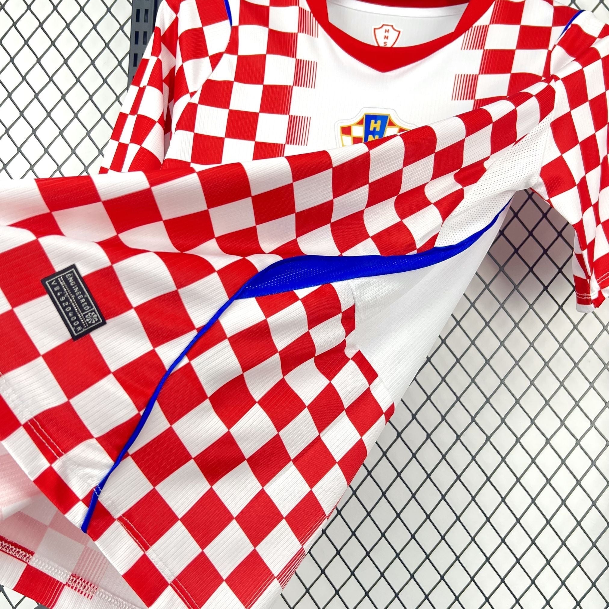 Leazofoot Croatia 2026 home soccer jersey with red and white checkerboard pattern and blue accents.
