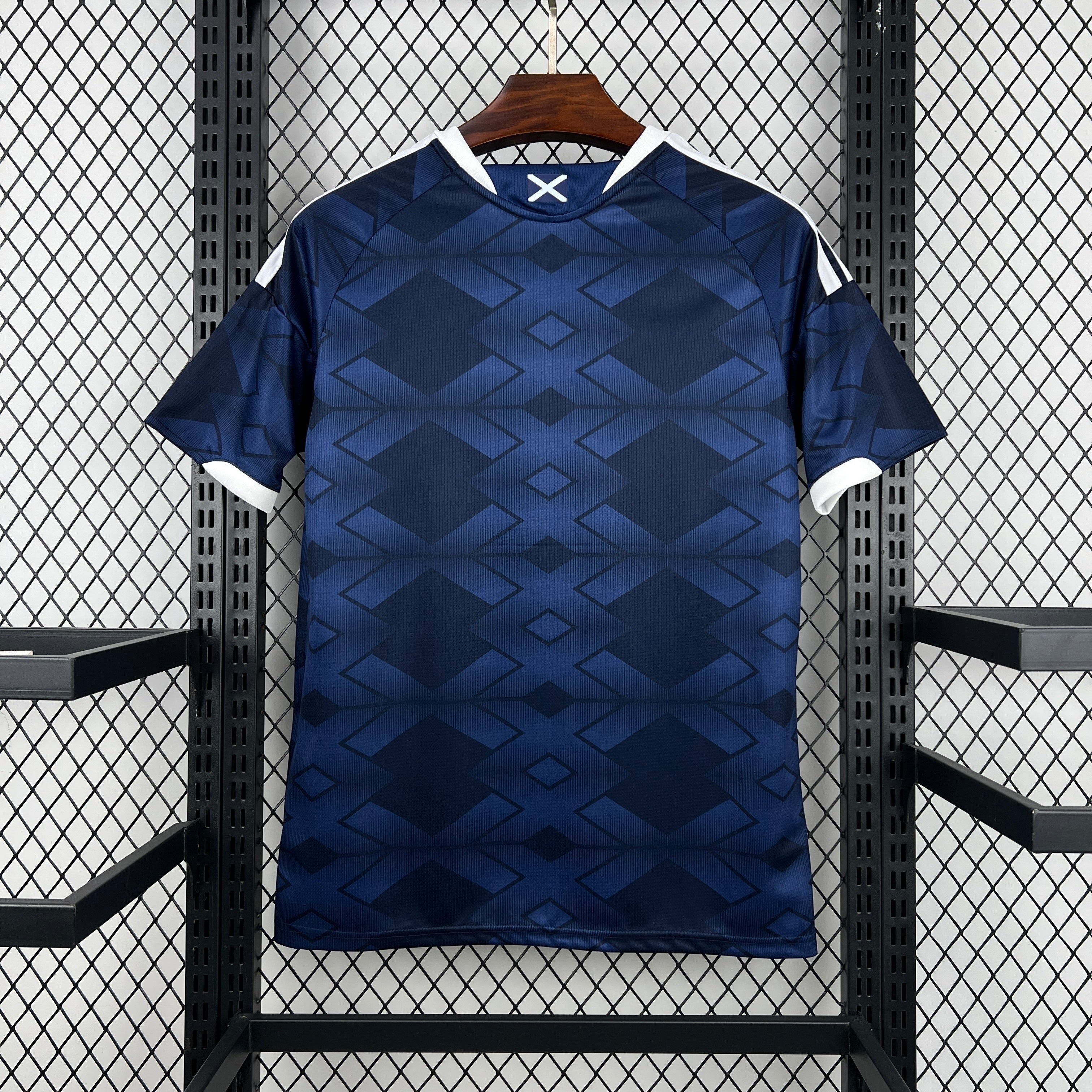 Leazofoot ÉCOSSE 2026 home jersey with a dark blue geometric pattern and white trim.