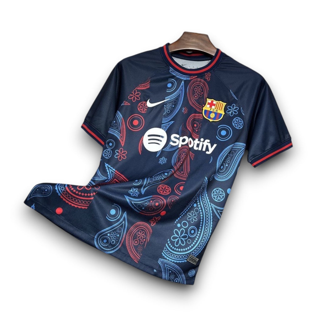 Leazofoot FC Barcelona 24/25 concept jersey in navy blue with red and light blue paisley pattern and team crest