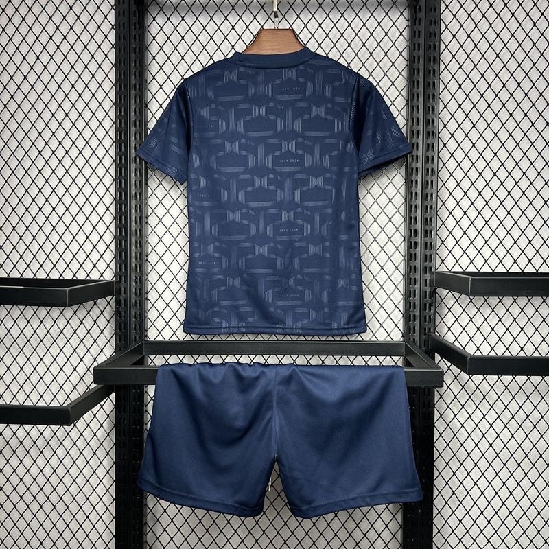 Leazofoot FC Barcelona 125th anniversary kids kit in dark blue with a subtle repeating pattern on the jersey back