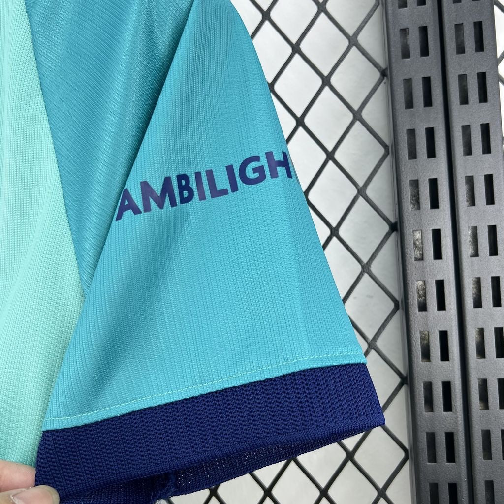Leazofoot FC Barcelona 26/27 third jersey sleeve in teal and light blue with dark blue trim and Ambilight sponsor.