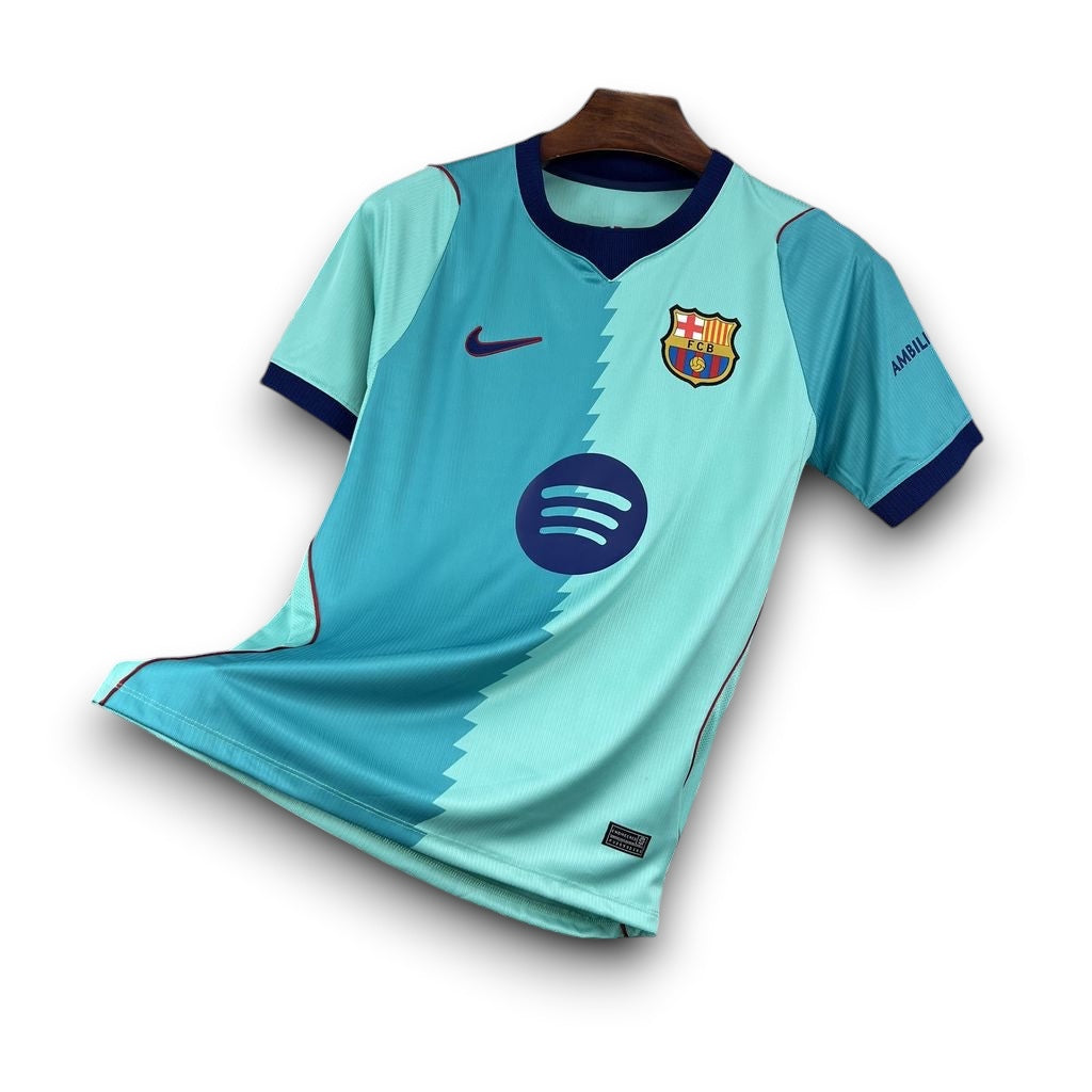 Leazofoot FC Barcelona 26/27 third jersey in light blue and teal with navy accents and club crest.