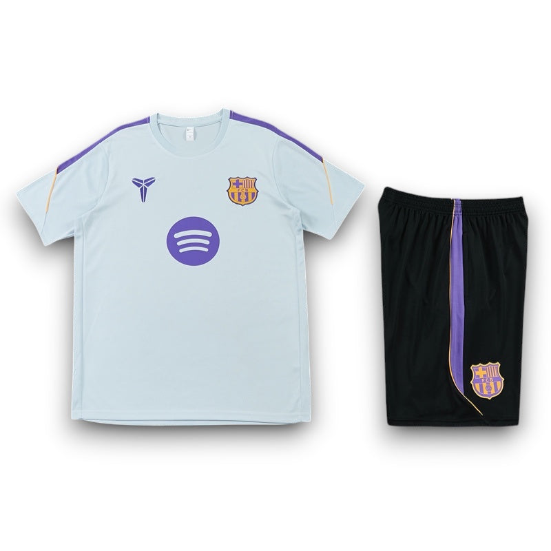 Leazofoot FC Barcelona 26/27 training set with light blue t-shirt and black shorts featuring purple accents