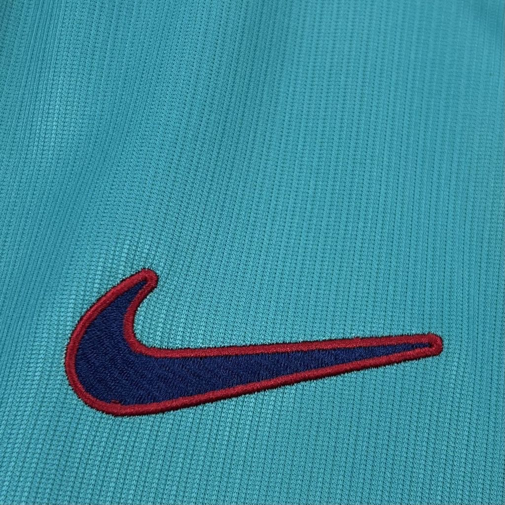 Leazofoot FC Barcelone 26/27 third jersey featuring a teal textured fabric with an embroidered navy and red Nike logo