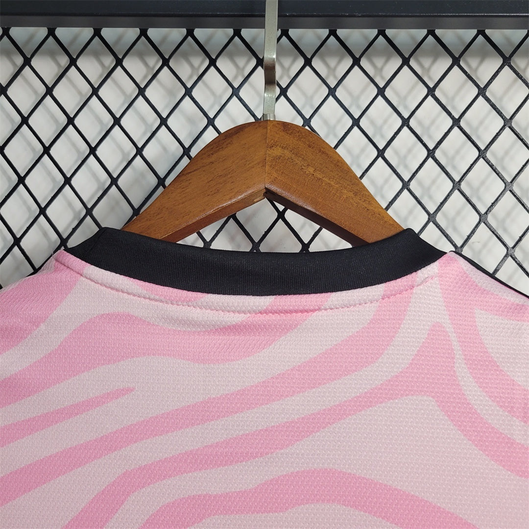 Leazofoot Flamengo 23/24 concept football jersey in pink and white zebra print with a black crew neck collar.