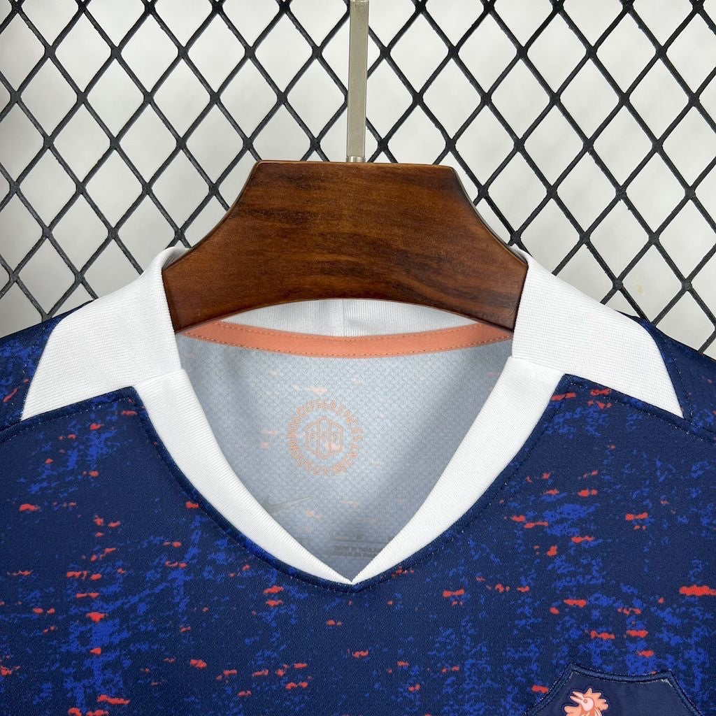 Leazofoot France 2025 home jersey featuring a blue textured fabric with white v-neck collar and orange interior trim