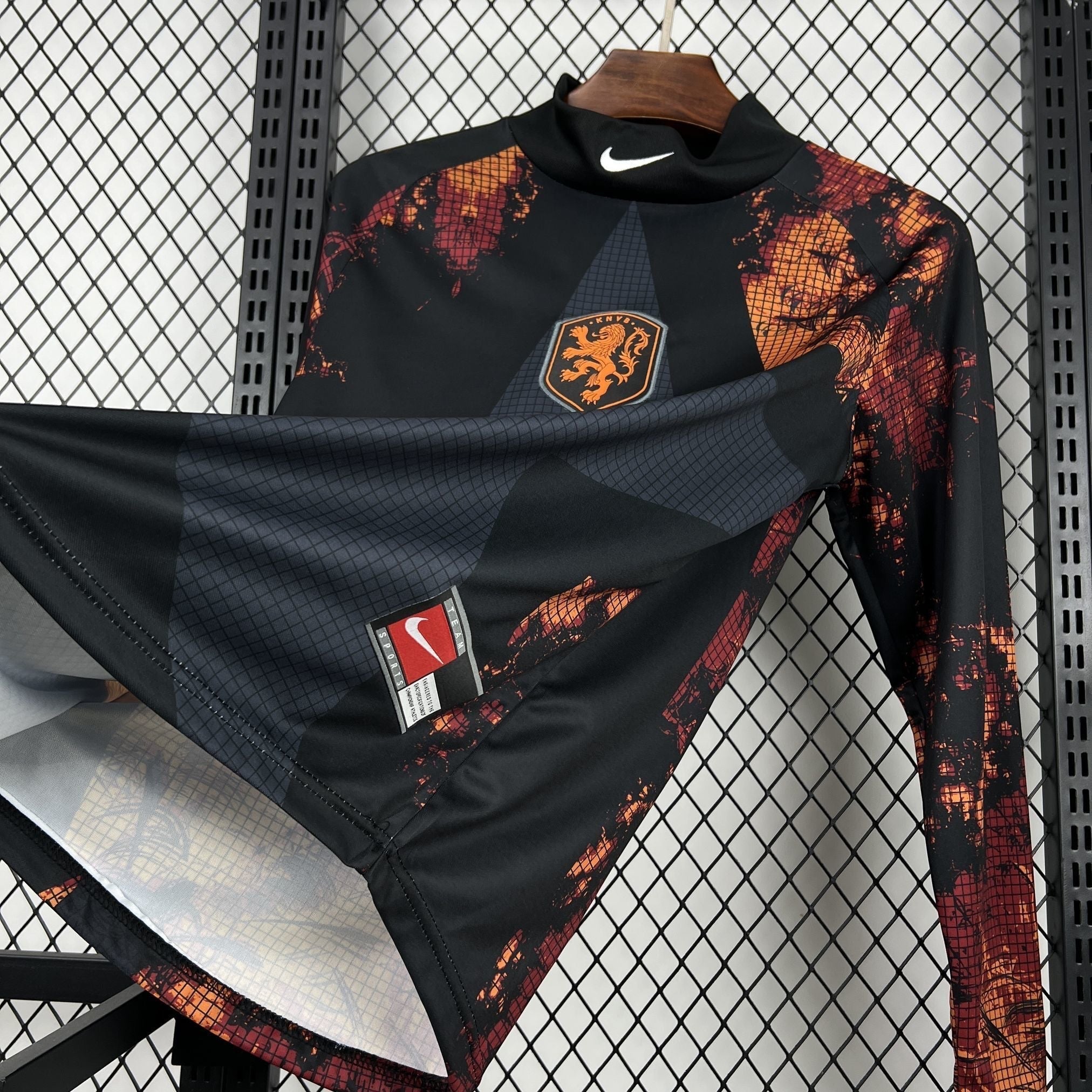 Leazofoot black long sleeve goalkeeper jersey with orange and red distressed graphic print and Netherlands crest.