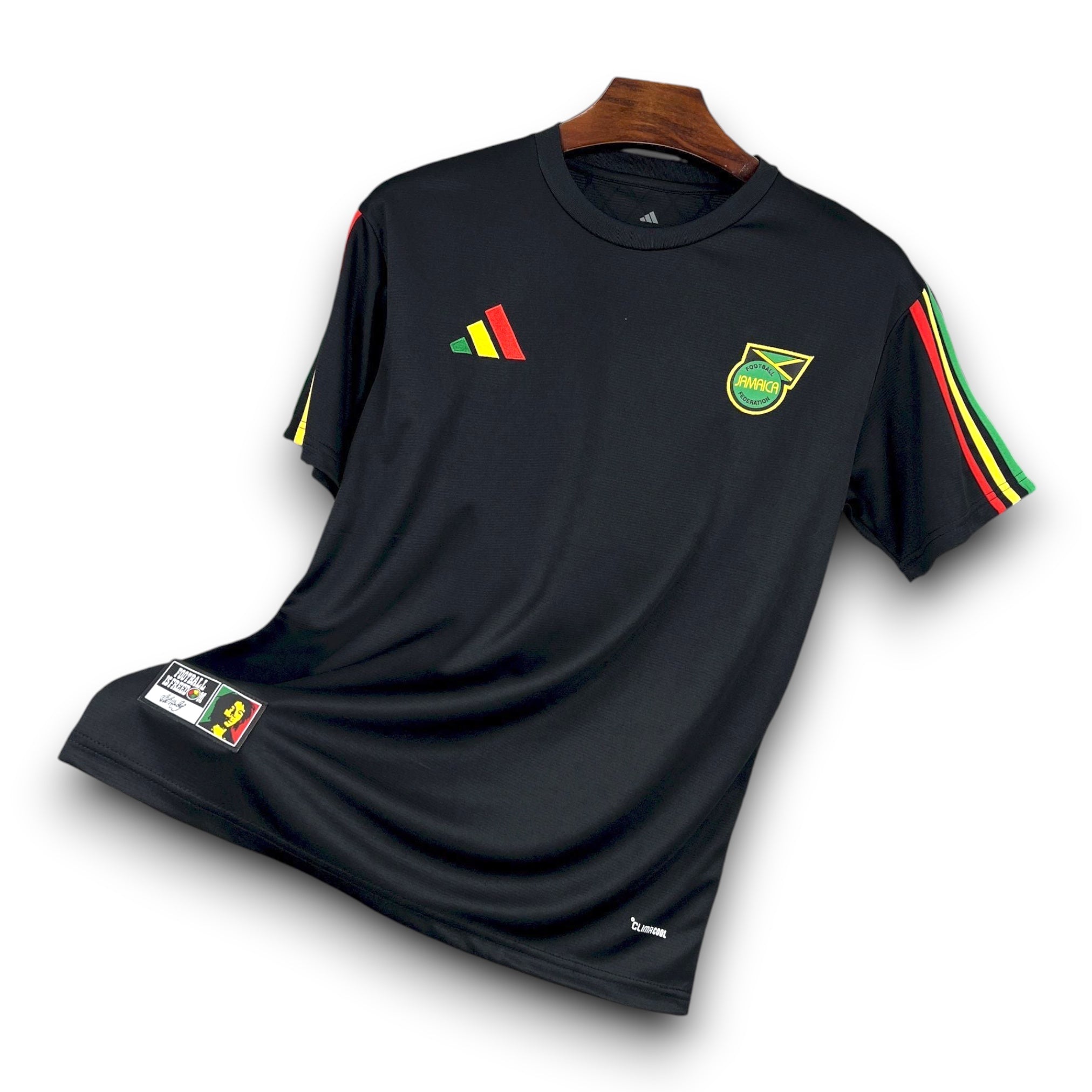 Leazofoot Jamaica 2026 concept football jersey in black with red, gold, and green sleeve stripes and team crest.