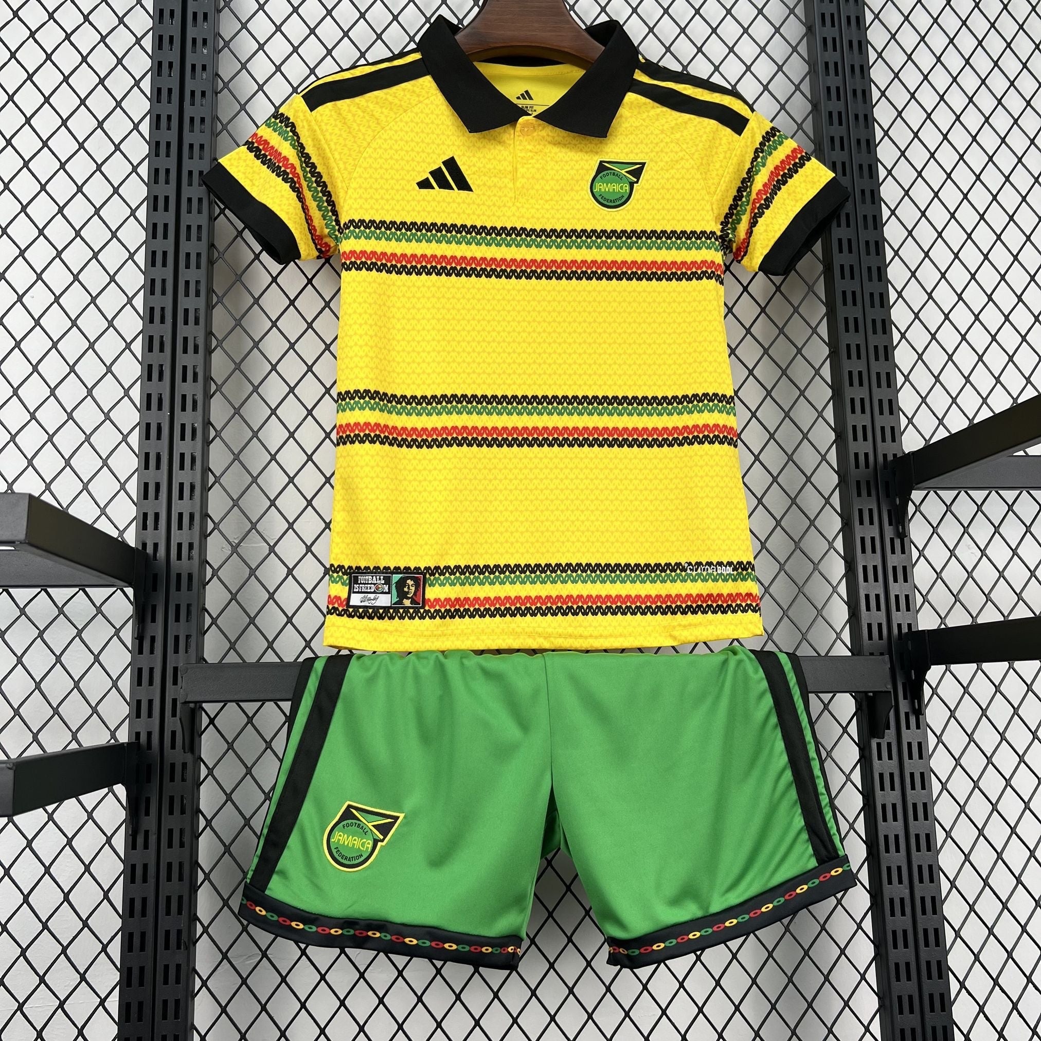 Leazofoot Jamaica 2026 kids home football kit with yellow polo shirt and green shorts featuring rasta-colored stripes