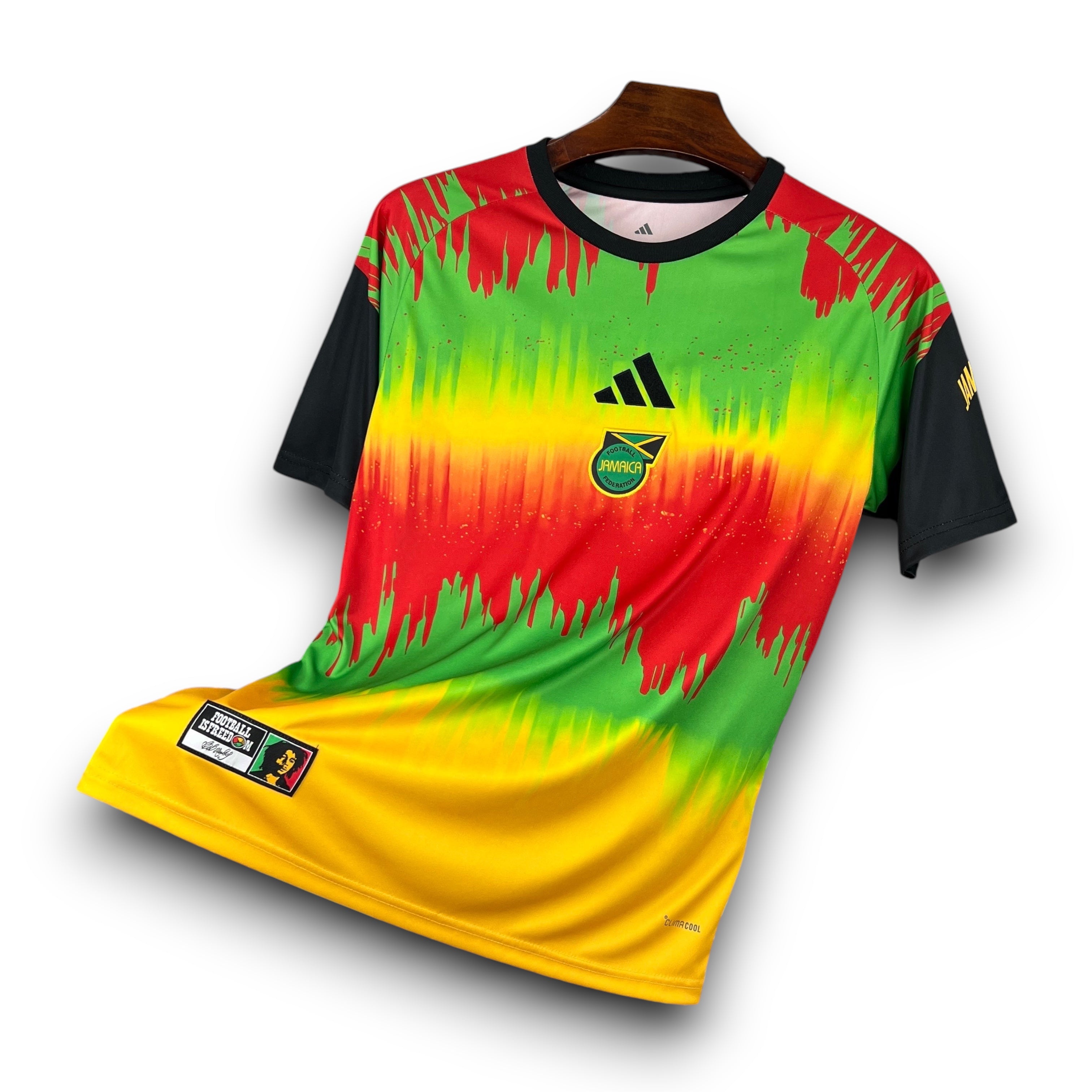 Leazofoot Jamaica 2026 pre-match football jersey in red, yellow, and green with black sleeves and team crest.