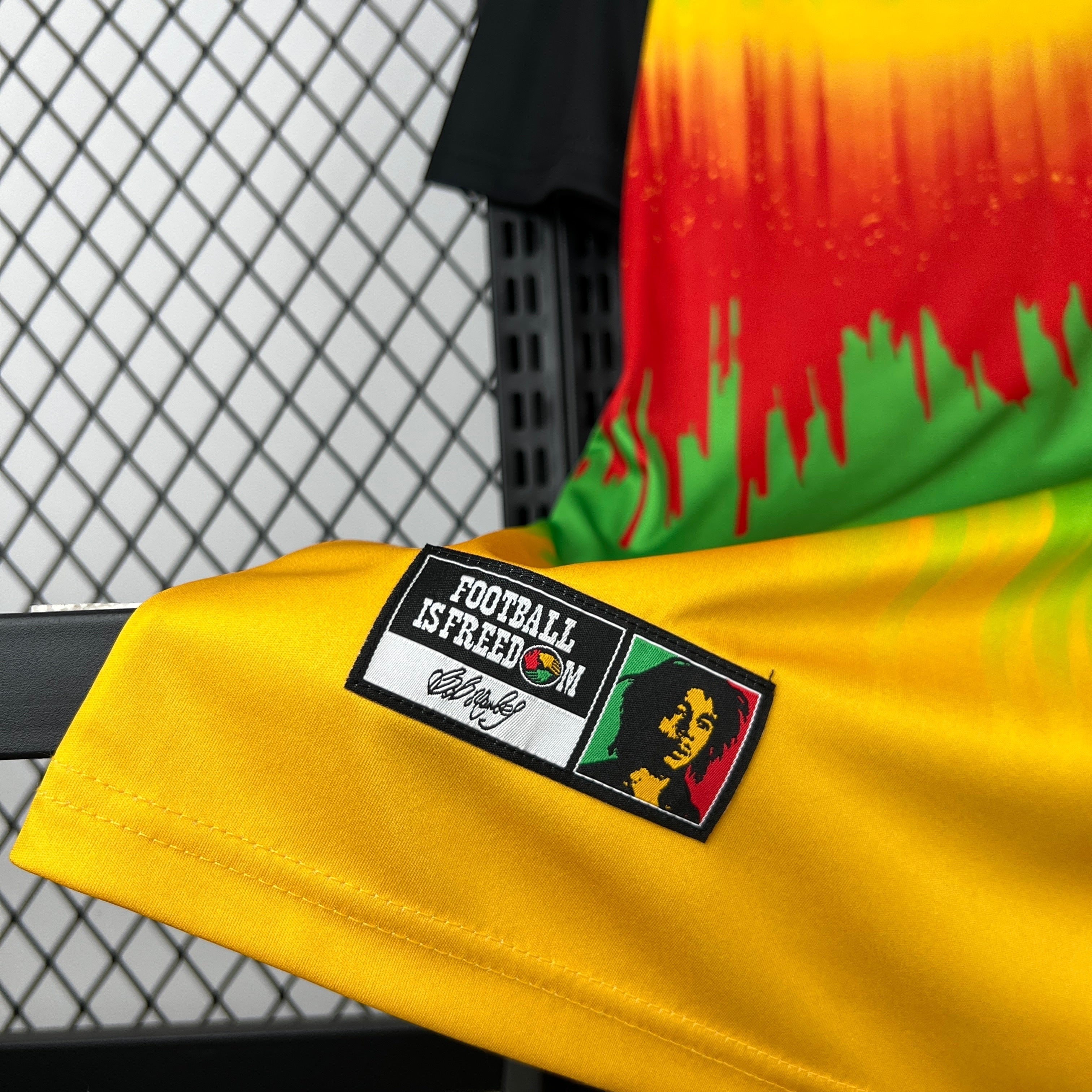 Leazofoot Jamaica 2026 pre-match football jersey featuring yellow, red, and green drip design with Bob Marley patch.
