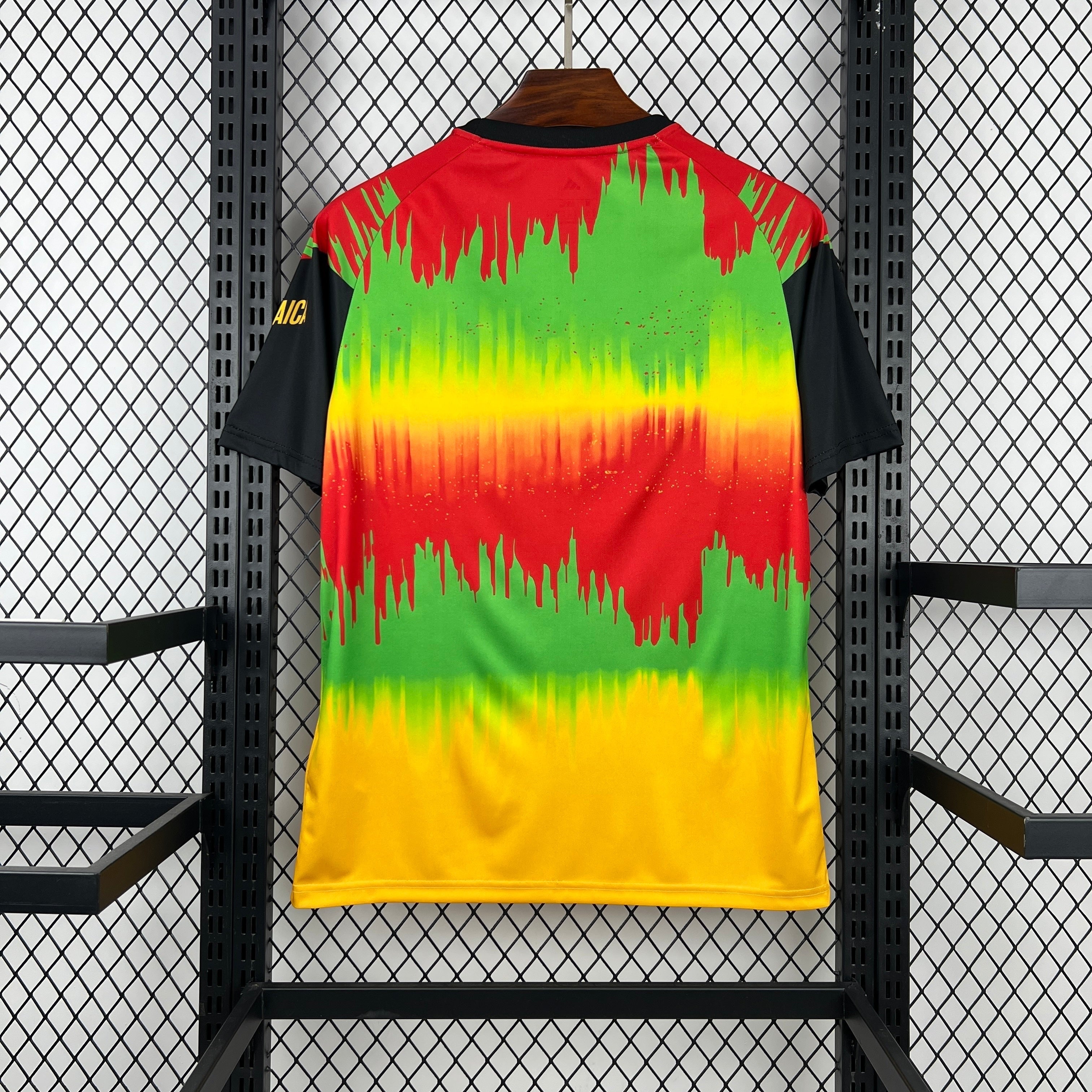 Leazofoot Jamaica 2026 pre-match soccer jersey featuring a vibrant red, yellow, and green abstract graphic print.
