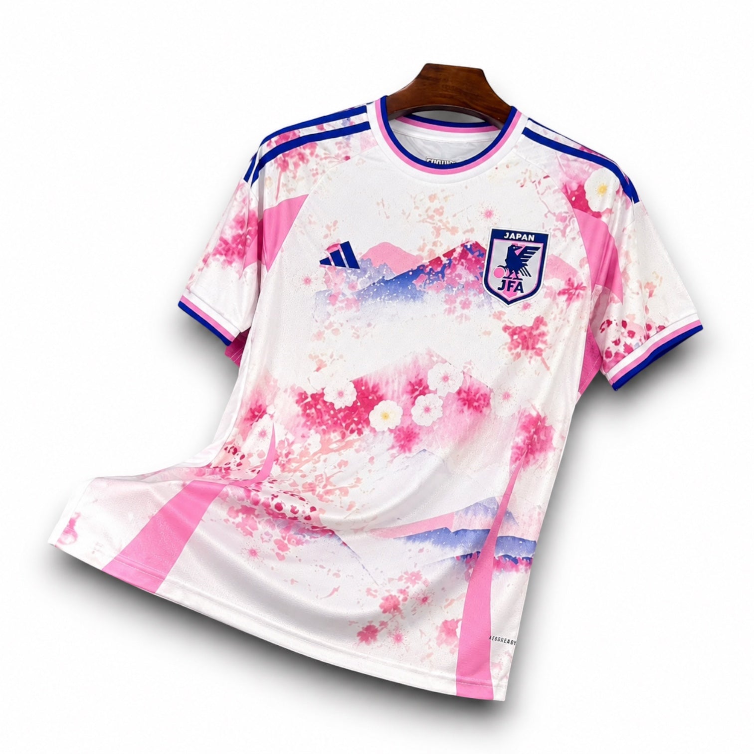 Leazofoot Japan 2024 concept soccer jersey featuring a white base with pink cherry blossom and mountain graphics.