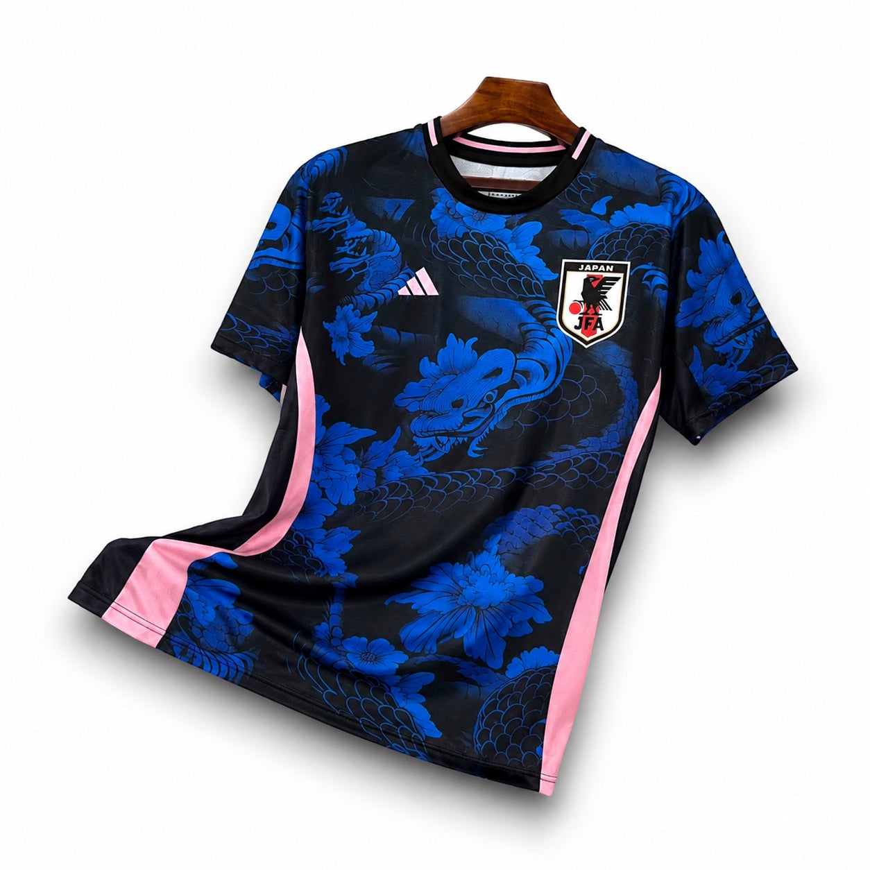 Leazofoot Japan 2024 concept soccer jersey in black and blue with dragon print and pink side panel accents.
