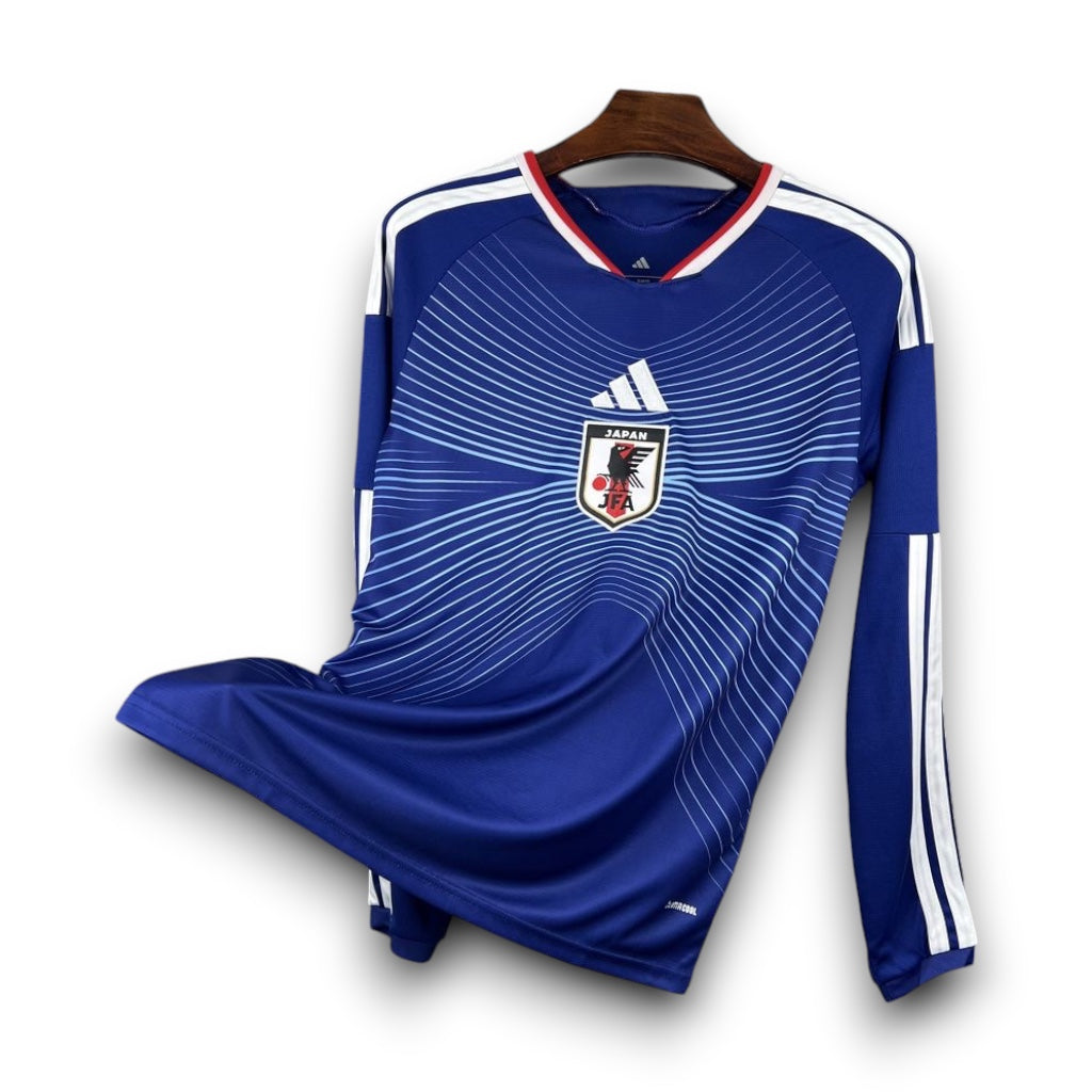 Leazofoot Japan 2026 long-sleeve home soccer jersey in blue with white stripes and team crest on a hanger